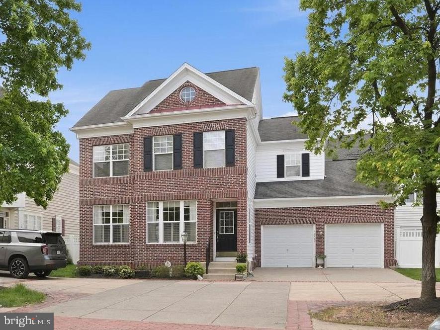 Set within one of Bristow’s most established and sought-after planned communities, this beautiful courtyard home offers the kind of presence, comfort, and everyday convenience buyers hope to find but rarely do. Braemar is known for its welcoming neighborhood feel, tree-lined streets, community events, and resort-style amenities, including two community pools, trails, tot lots, basketball courts, a tennis court, pickleball court, pavilion, and outdoor gathering spaces. With nearby shopping, dining, commuter routes, and access to the VRE within reach, Braemar delivers that ideal Northern Virginia balance: a true neighborhood lifestyle with everything you need close by.

From the moment you arrive, this home feels lovely, stately, and ready to welcome its next chapter. Inside, classic details like plantation shutters, recessed lighting, and crown molding elevate the ambiance, giving each space a refined yet comfortable feel. The entry opens to an expansive view of the main level, where formal living and dining areas flow beautifully toward the heart of the home. It is the kind of floorplan that immediately feels open, gracious, and easy to live in — perfect for everyday living, special gatherings, and everything in between.

The family room is warm and inviting, anchored by a gas fireplace and seamlessly connected to the kitchen and breakfast room. This open arrangement creates the natural gathering space every buyer loves, whether it is morning coffee, weeknight dinners, or a full house during the holidays. The kitchen offers abundant cabinet space, tile flooring, rich dark cabinetry, black appliances, and a generous pantry, combining function and style in a way that makes daily life feel effortless.

Upstairs, the oversized primary suite feels like a true retreat. A spacious sitting area creates room to unwind, read, work, or simply enjoy a quiet moment at the end of the day. Two walk-in closets provide the storage buyers dream about, while the ensuite bath adds a sense of luxury with tile flooring, a corner soaking tub, separate walk-in shower, and two separate vanities. Two additional bedrooms share a full hall bath, and the upper-level laundry room makes laundry day refreshingly convenient — because hauling baskets up and down stairs is not exactly anyone’s love language.

The lower level is equally impressive, offering two large finished spaces that can easily flex to fit your lifestyle. Create a game room, rec room, theater room, fitness space, playroom, or all of the above. An additional large unfinished area provides exceptional storage or the opportunity to finish even more living space in the future.

Elegant, spacious, and beautifully positioned in the heart of Braemar, this home checks all the boxes. It offers timeless details, generous living spaces, move-in-ready appeal, and access to one of Bristow’s most beloved community lifestyles. From the stately first impression to the flexible finished lower level, this is a home designed to feel impressive on day one — and wonderfully livable for years to come.