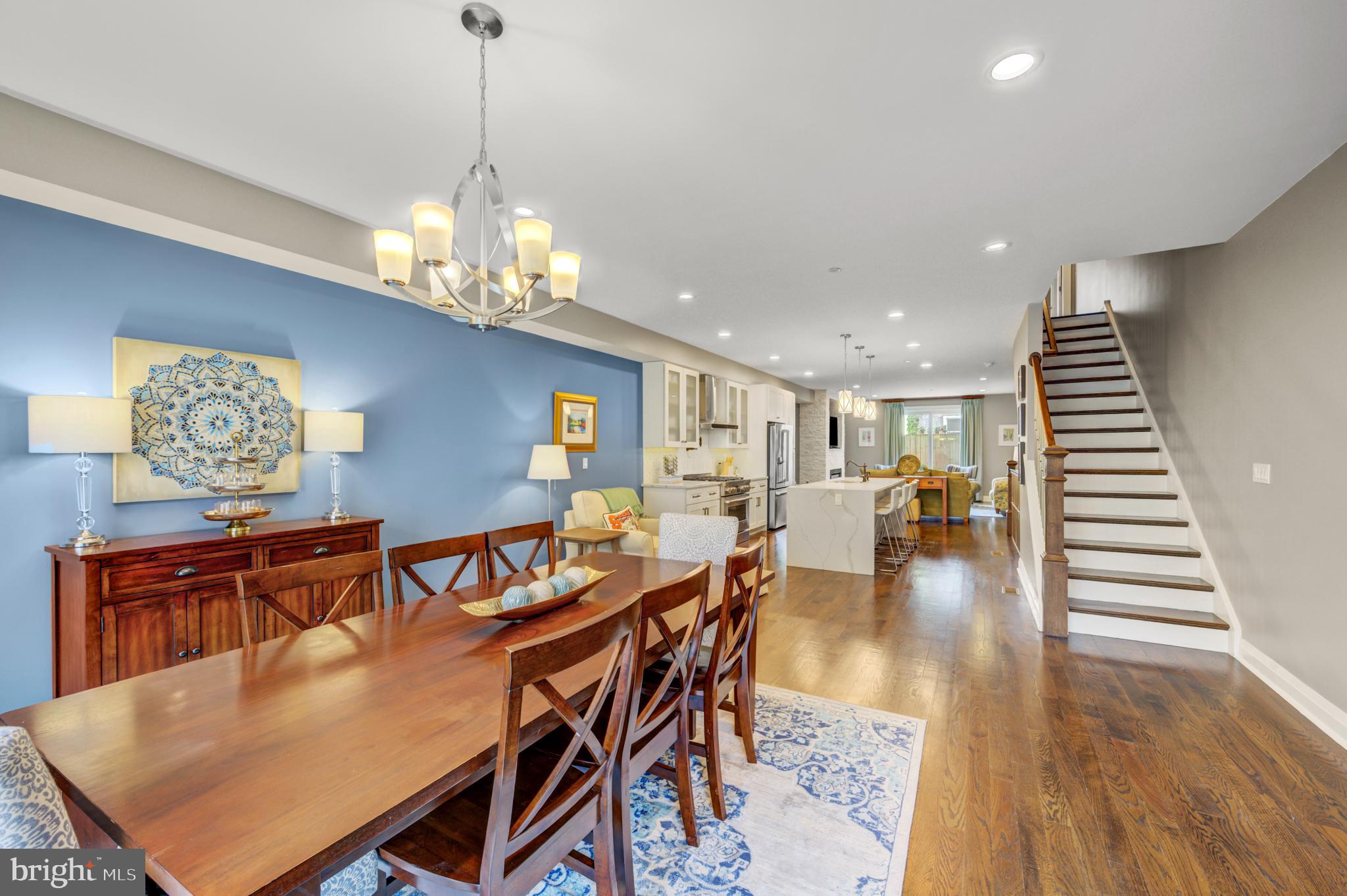 Nestled in the coveted Art Museum Area, this stunning contemporary townhome offers the perfect blend of luxury, sophistication and city living. Built in 2017 and meticulously upgraded throughout, this elegant four story residence boasts large living space, breathtaking skyline views and the rare convenience of an expansive two car garage. Step through the grand foyer and immediately admire the gleaming oak hardwood floors that flow throughout the home. The entry level features a spacious family room with custom built-in shelving, recessed lighting, a convenient powder room, abundant storage and direct access to a spacious two car garage. Designed for both everyday living and effortless entertaining, the open-concept main level is truly spectacular! The inviting living room showcases custom built-in bookcases, a dramatic stone gas fireplace and sliding glass doors opening to a large private deck- perfect for al fresco dining! At the heart of the home is a chef's dream kitchen featuring upgraded cabinetry, quartz counter tops, stainless steel appliances, pendant lighting, a pot filler over the stove and a generously sized island with seating for four. The elegant dining area, bathed in natural light through the floor to ceiling window, is the perfect space to host unforgettable dinner parties beneath a stunning chandelier. The next level offers two spacious bedrooms, including a private guest suite with recessed lighting, ceiling fan, generous closet space and a beautifully tiled ensuite bath. An additional large bedroom, full half bath with upgraded finishes, laundry room with full sized washer & dryer and a generously sized storage room complete this floor. The luxurious primary suite level is a true retreat straight out of a five-star resort! The serene primary bedroom features a floor to ceiling stone gas fireplace, creating warmth and ambiance, while the spa-inspired bath offers a soaking tub, expansive double shower, elegant double vanity with designer cabinetry and a private water closet. A custom walk-in closet with built-in shelving and drawers adds exceptional convenience and style. A fourth bedroom completes this level. Crowning this extraordinary home is an expansive rooftop deck with breathtaking panoramic views of Center City Philadelphia. Whether hosting unforgettable parties or unwinding under the city lights, this incredible outdoor space provides the ultimate urban backdrop! Perfectly situated just steps from premier dining, shopping, and public transportation and within walking distance to iconic destinations and historical landmarks including the Barnes Foundation, Philadelphia Museum of Art and the Rodin Museum, this exceptional residence offers luxury city living at its finest. Convenient to Center City, 30th Street Station, major highways and bridges, and all the fun and culture the City of Brotherly Love has to offer! ** Time remaining on Tax Abatement.