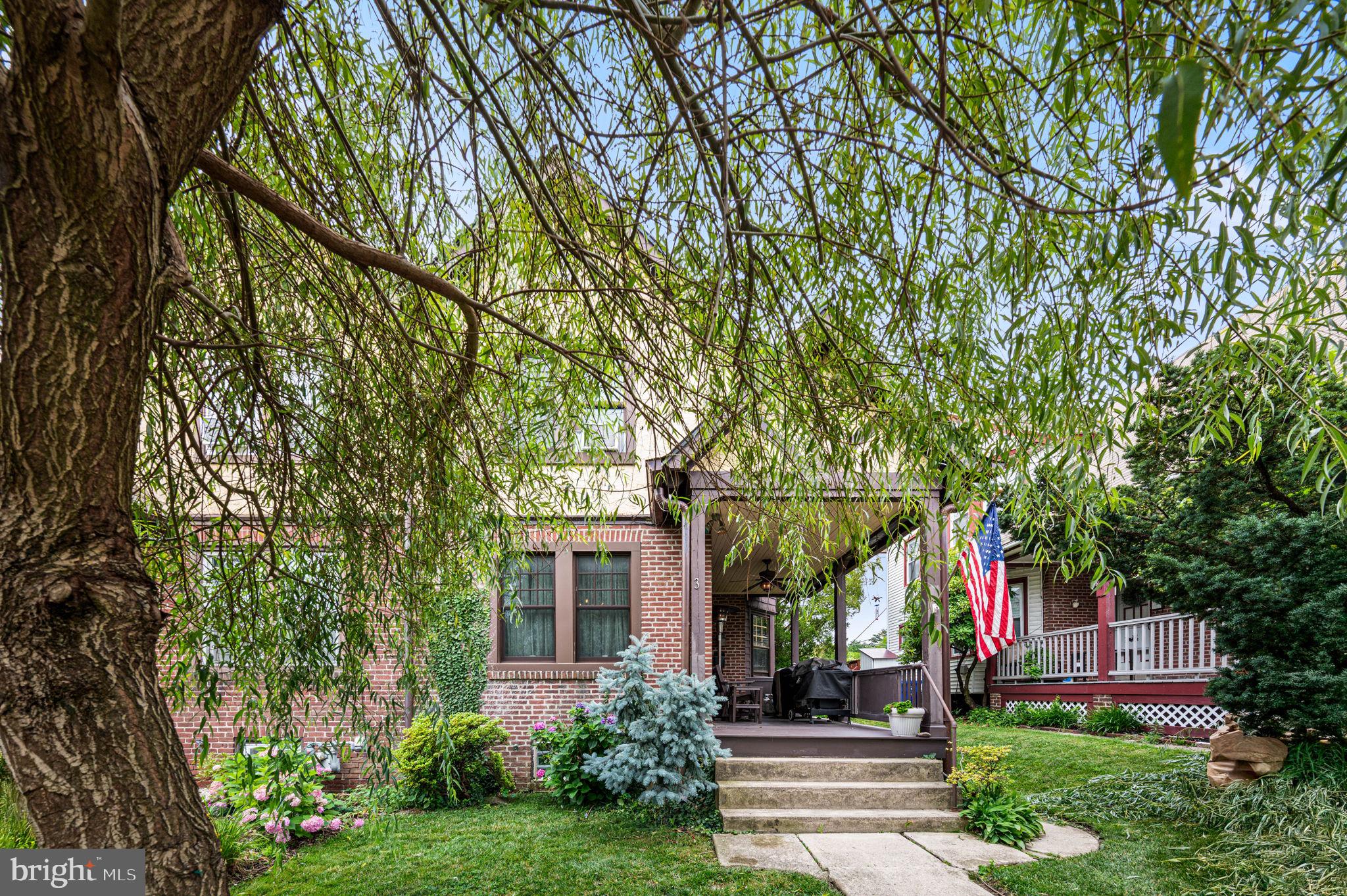Character and charm meet thoughtful updates in this 1915 masonry home tucked into a quiet corner of Elkins Park. From the moment you arrive, mature trees and inviting curb appeal set the tone for a property that has been well loved and well maintained. The covered front porch, complete with a ceiling fan, offers a welcoming spot to relax and enjoy the neighborhood.
Step through the front door into a dining room set at the front of the home, leading into a center living room and a kitchen that has been opened up to create an easy, connected flow. The kitchen features an apron front sink and a butcher block countertop that carries the eye right through to the living space, making it a natural gathering spot for everyday living and entertaining alike.
Upstairs, three spacious bedrooms share a full bathroom, offering comfortable space for however you live, work, or host. The front windows, along with the kitchen and bathroom windows, were replaced with Anderson windows, bringing natural light and efficiency to the home's classic bones.
Out back, a covered deck extends the living space outdoors, perfect for morning coffee or evening dinners regardless of the weather. The yard also features a charming greenhouse, ideal for anyone with a green thumb or looking to start one. Parking is a breeze here, with a covered spot under the carport plus an additional space in the driveway accessed from the alley behind the house. Guests will find parking nearby with ease as well.
The basement is unfinished but well equipped, with two sump pits and pumps, one of which includes a battery back up for extra peace of mind.
A four person hot tub, installed in 2025, is negotiable with the sale, along with select furniture pieces throughout the home. Buyers interested in specific items are encouraged to ask for details.
Recent updates bring further peace of mind, including a new roof upgraded with copper gutters and downspouts in 2025, a new hot water heater in 2023, and a central air system installed in 2024.
This is a home with personality, updates where it counts, and outdoor spaces that make it truly special. Schedule your private showing today!