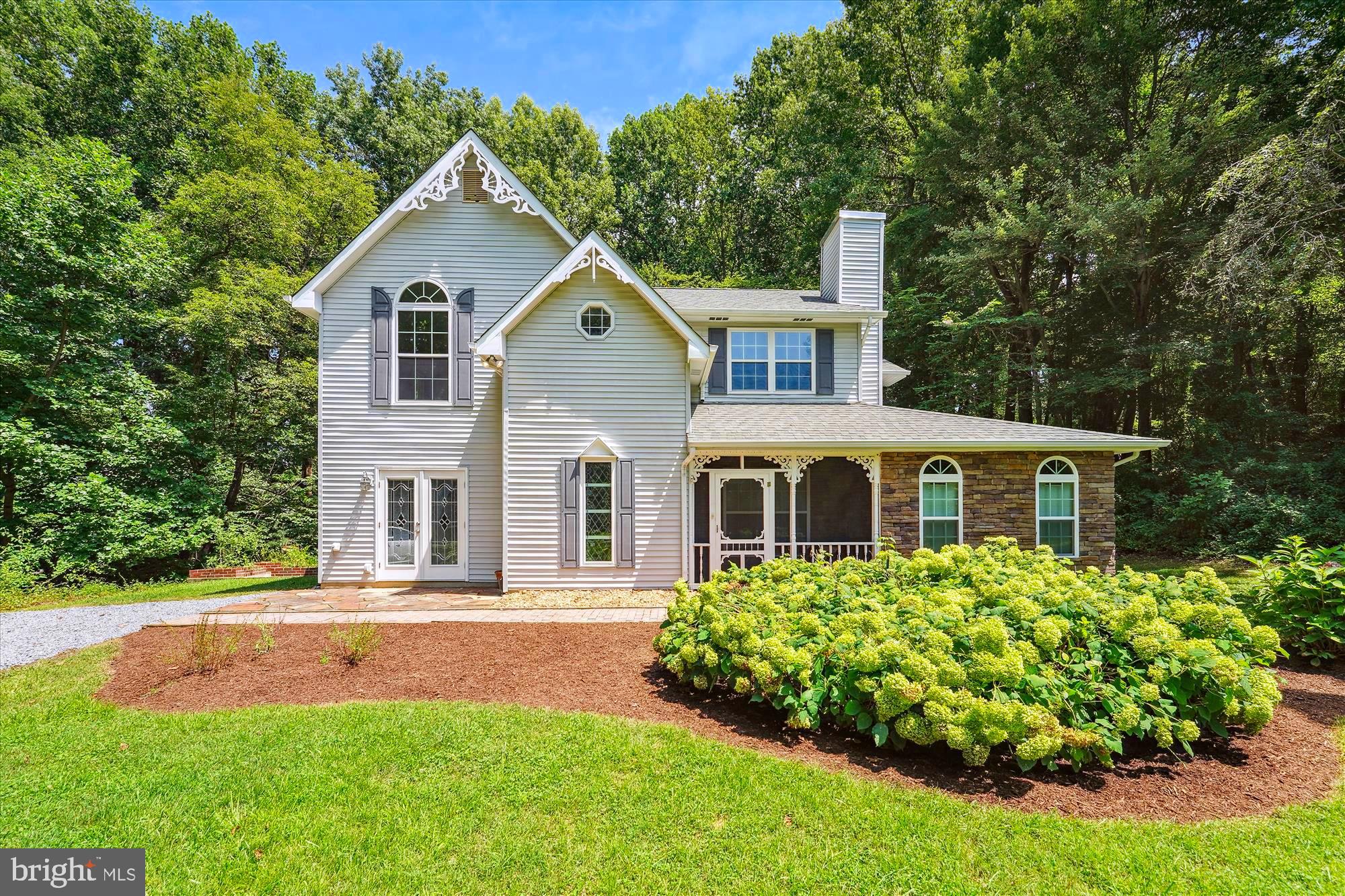 BEAUTIFUL COLONIAL HOME WITH GREAT  ON 3 PRIVATE ACRES **  You Will Love This Home!!! Very Well Maintained & Updated Recently!    Cozy Screened-In Front Porch  where you can Sit, Relax & drink your Coffee or Wine!  This Beautiful Home Features an Open Floor Plan, has been Freshly Painted, New Carpeting, Lots of Upgrades throughout!!! The Entrance Foyer has Marble Tile Flooring & Coat Closet * Spacious Living Room with Wood Floor &  Wood Burning Fireplace w/Beautiful Antique Wood Mantel * Upgraded Gourmet Kitchen in 2015 with Maple Cabinets, Wine Glass Holder Under the Cabinets, Cabinet w/Built-in-Spice Rack, Granite Countertops with Tile Backsplash, Upgraded Stainless Steel Appliances, Gas Cooktop, Island w/Wine Fridge, Breakfast Area w/Built-in-Seating, Ceramic Tile Flooring, Pantry & Bay Window  * Separate Dining Room with Wood Flooring, Fancy Trim & Bay Window * Family Room has a Fireplace with Beautiful Antique Wood Mantel, Wood Flooring & French Door to the Front Yard Patio  * Updated Powder Room with Granite, Modern Sink, New Cabinet, Ceramic Tile Flooring * Storage/Utility Room has a Freezer & Door to Back Yard * 4th Bedroom or could be Office/Den with Built-In-Cabinets, Granite Countertops, Ceiling Fan w/Light, Custom Blinds w/Remote, Fujitsu AC/Heat Wall Unit & 2 Closets *** THE UPPER LEVEL FEATURES Hallway with Wood Flooring & Attic Access * Primary Bedroom has a Vaulted Ceiling, Palladium Windows, Ceiling Fan w/Light & Beautiful Updated Primary Bathroom with Granite, Ceramic Tile Shower, Spacious Walk-in-Closet, Ceramic Tile Flooring * The 2nd Bedroom has a Ceiling Fan w/Light plus a Beautiful Attached Sitting/Sun Room with a French Door separating the bedroom, Built-in-Safe (behind picture), Skylight, Ceiling Fan w/Light, Palladium Windows & access to the Upper Level Screened-In-Porch * The 3rd Bedroom has an Extra Large Storage Closet * Updated Hall Bath with Granite Countertop, Beautiful Cabinet, Shower Door * Upper Level Washer & Dryer * Two Screened-In-Porches off the Back of House/Upper and Lower Level with Trex Deck & Ceiling Fans with Lights * Shed * Gutter Guards *  Updates Include newer: Roof, Heat Pump, Windows, Kitchens, Baths, Carpet, some Insulation in the Attic & more * Absolutely Beautiful Home!!!  Conveniently located to Shopping, Chesapeake Bay Boardwalk/Restaurants/Water Park.  Conveniently located to Annapolis, Washington DC, Andrews AFB, BWI & so much more!  Covenants but No HOA * Horses Permitted * Community Pond * Lots of Flowering Shrubs & Trees which includes Magnolias, Crepe Myrtles, Pear Tree, Holly Tree, Maple Tree, Perennials, Hydrangeas, Herb Garden, & a Private Back Yard with a Fishpond!