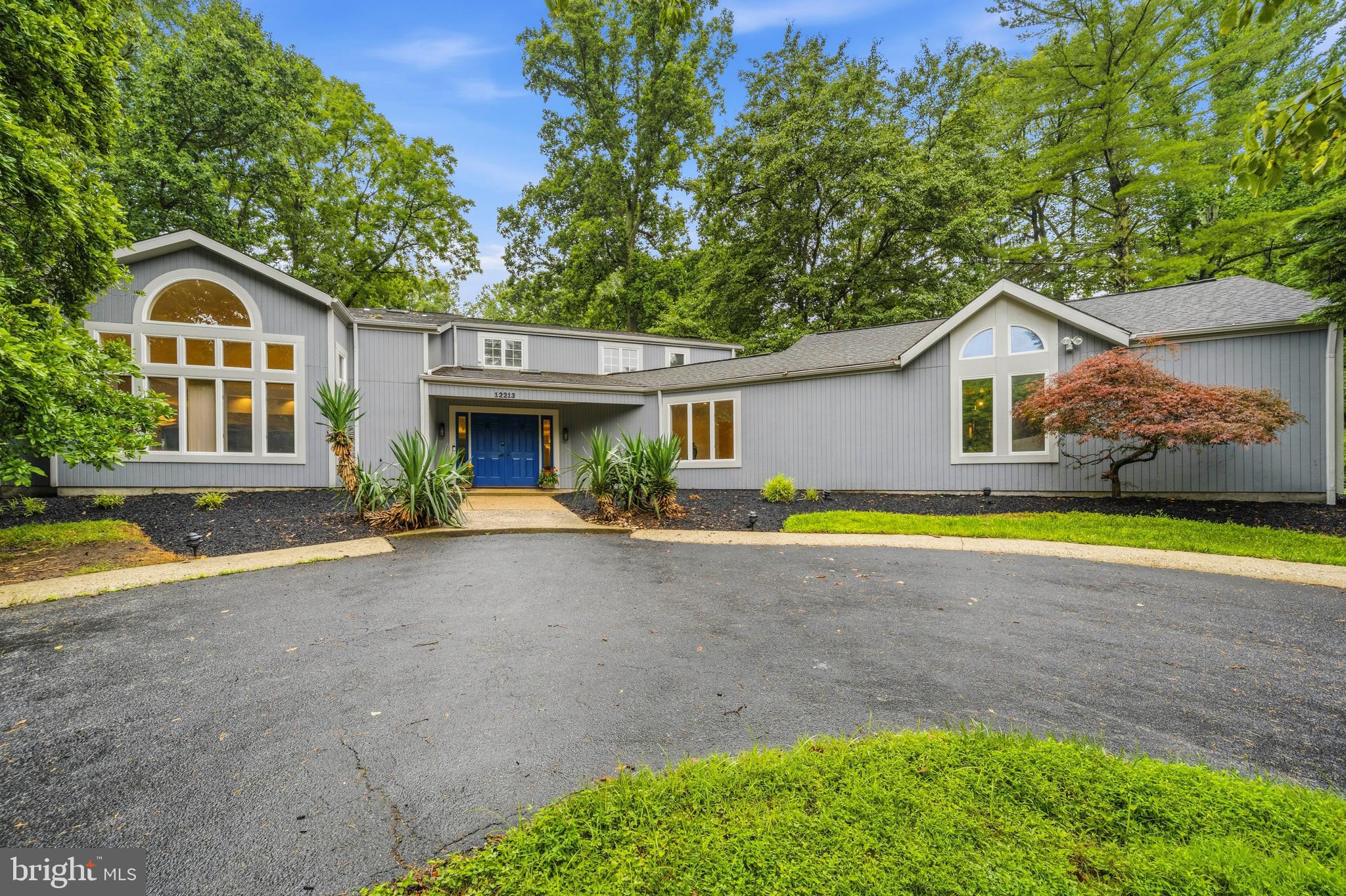 Welcome to 12213 Fawnhaven Court, a spectacular, fully updated four-level contemporary home nestled on a private cul-de-sac in Ellicott City. Boasting four spacious bedrooms, three beautifully renovated full bathrooms, and extensive mechanical upgrades, this bright, open, and airy residence perfectly blends dramatic architectural design with modern comfort and peace of mind.

The home offers exceptional curb appeal with fresh professional landscaping, a circular driveway, an additional private driveway entrance from the side street, and an oversized two-car garage.

Recent improvements include:

Roof is approximately 10 years old with 50-year shingles
Two-zone HVAC systems (basement unit approximately 10 years old; main-level unit approximately 5 years old)
Recently updated water treatment system
Brand-new carpeting throughout
Fresh interior and exterior paint
Three fully renovated bathrooms
New quartz kitchen countertops
New gas cooktop and refrigerator
New all-in-one washer/dryer combination
And much more
Main Level

Step into the gracious, sun-drenched foyer. To the left, a spacious family room with soaring cathedral ceilings flows seamlessly into the open-concept chef's kitchen, beautifully updated with new quartz countertops and stainless steel appliances.

Just off the kitchen, a bright sunroom addition provides the perfect space for entertaining, complete with a wine bar, built-in cabinetry, and access to the patio—ideal for grilling and outdoor dining. The kitchen also connects effortlessly to the formal dining room.

Privately situated down the hall is a desirable main-level bedroom, perfect for guests or multigenerational living, accompanied by a fully renovated bathroom. This level also provides access to the laundry room and oversized two-car garage. 

Mid-Level

Just a few steps up, you'll find a dramatic second living room featuring French doors that open onto an expansive deck overlooking the private backyard—an ideal setting for relaxing or entertaining.

Upper Level

The upper level features a luxurious primary suite with its own sunroom and a beautifully renovated en-suite bathroom. Two additional bright bedrooms share another fully renovated full bath.

A true standout feature is the private indoor sauna, creating your own spa-like retreat. The hallway also showcases beautiful built-in bookshelves with a sliding library ladder, adding both charm and functionality.

Lower Level

The lower level offers abundant storage space, a utility room, and additional flexible space ready to meet your needs.

Location

This move-in-ready architectural gem is a rare offering in the sought-after Woodmark community, featuring a low voluntary HOA that sponsors annual picnics, trick-or-treat events, and other neighborhood gatherings.  Mortgage savings may be available for buyers of this listing.