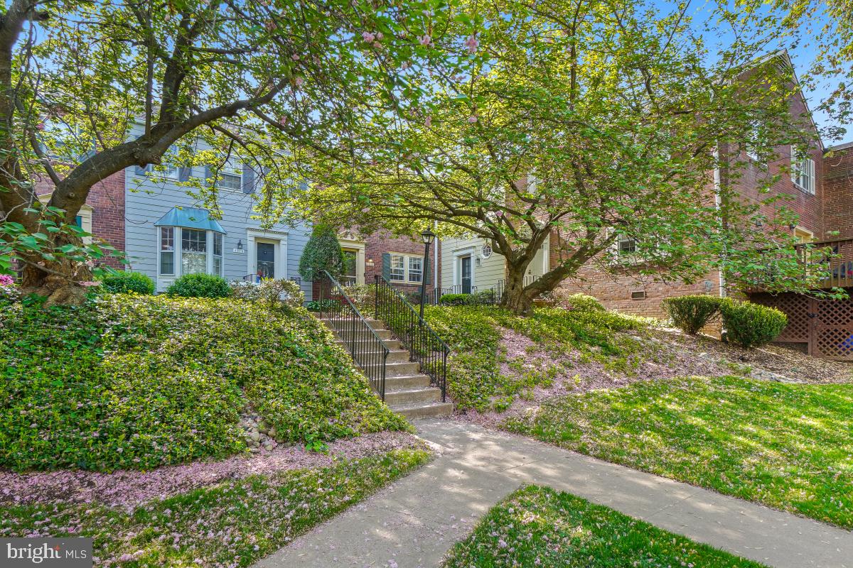 Location, Location, Location!  Welcome to 4922 Bradley Blvd a two level condo with 3 bedrooms and 2.5 baths.  Walking from the parking to the front door of the unit you can't help but appreciate the well kept lush garden area. Once you step inside the unit you are welcomed with the gleaming hardwood floors that lead to the eat-in kitchen and the great room.  The great room includes a  fireplace, custom built-ins, and plenty of space for a dining table and seating area. There is access to the large back deck from the great room.  Upstairs is where you will discover the primary bedroom with en-suite bath, two additional bedrooms, and a full bath.  Located just steps to shopping, dining, and all that Bethesda and Chevy Chase have to offer!