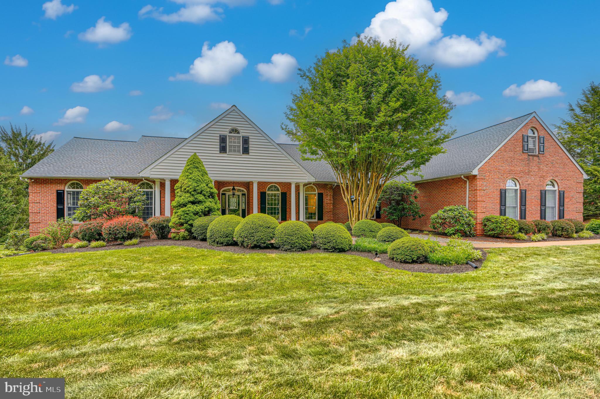 Prepare to be amazed by the incredible space, versatility, and endless possibilities this custom Rancher/Cape Cod situated on 2.03 picturesque acres has to offer! With over 5,300 finished square feet, this expansive home combines comfortable one-level living with room to grow. Step inside to find a spacious Living Room featuring soaring vaulted ceilings, a dramatic floor-to-ceiling brick wood-burning fireplace, and an upper-level loft overlook that adds to the home's open and inviting feel. The Formal Dining Room is perfect for entertaining, while the private Office provides an ideal work-from-home space.
The heart of the home is the large Eat-In Kitchen with breakfast bar that opens to the welcoming Family Room, highlighted by a second floor-to-ceiling brick fireplace. The enormous Primary Suite offers a private retreat complete with a spacious walk-in closet and Primary Bath. Need more bedrooms? The possibilities are endless! The upper-level attic storage areas feature flooring, high ceilings, and substantial space, creating an excellent opportunity for future expansion and additional bedrooms (buyers to confirm with the county). The fully finished walk-out lower level is designed for entertaining and everyday living, featuring a large Rec Room, wet bar, full bath, cedar closet, and an enormous storage room. Additional highlights include a Brand New Roof, Zoned Heating & Cooling, Built-In Generator, Rear Deck w/Built-In Covered Awning. If you've been searching for a home that offers exceptional square footage, room to expand, abundant storage, and endless potential, this is the one you've been waiting for!  Please note: Radio towers currently located on the property will be removed prior to settlement.