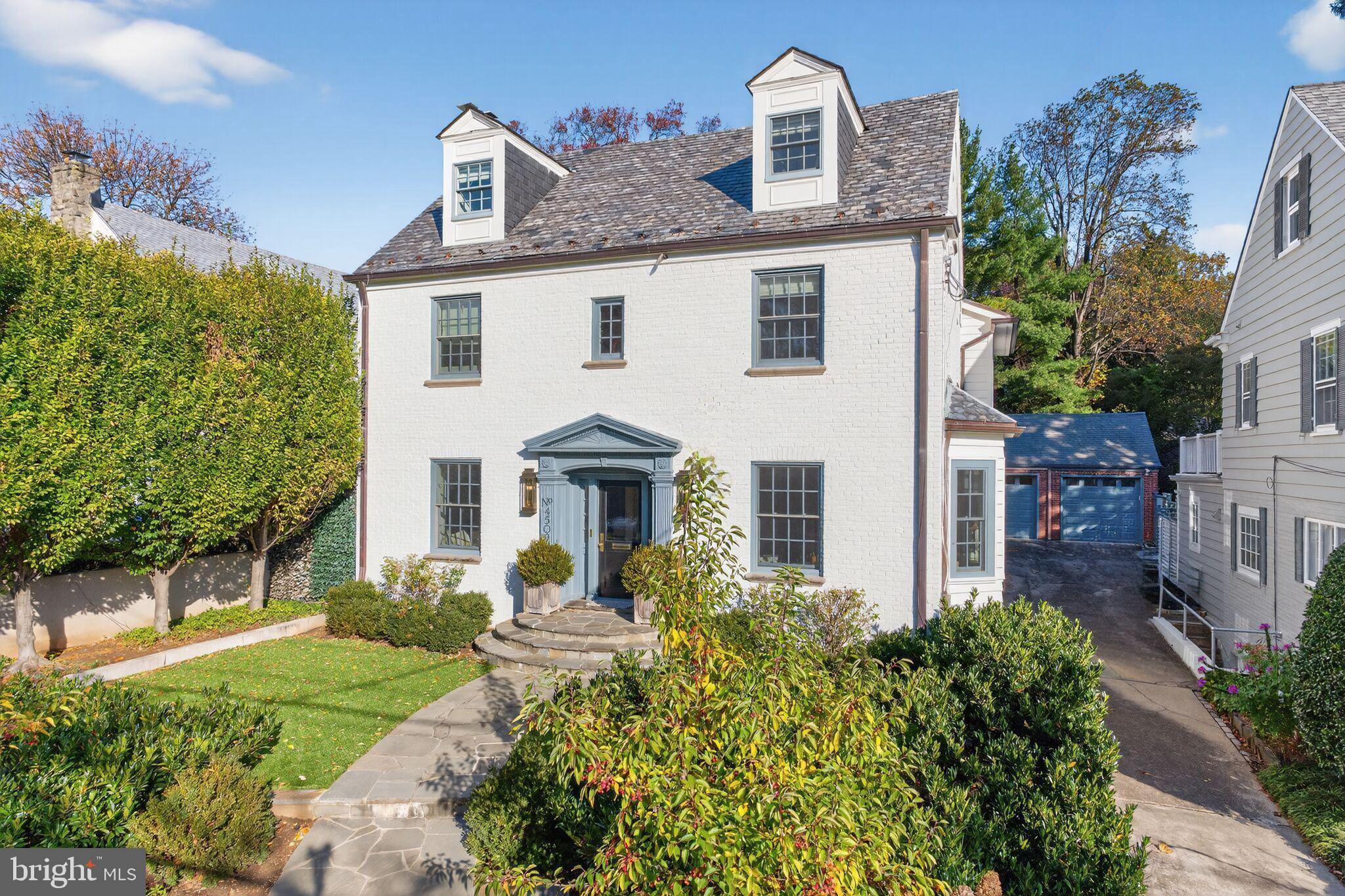 Situated in the prestigious Wesley Heights neighborhood, one of the city's most coveted addresses, this elegant and modern Colonial residence represents a fantastic blend of timeless architectural sophistication and contemporary luxury design. Thoughtfully reimagined by renowned interior designer Ally Banks, this exceptional property offers over 3,600 square feet of meticulously appointed living space, featuring five generously proportioned bedrooms and four and a half exquisitely finished bathrooms, all complemented by resort level pool and landscaping.

The first floor presents an impressive open floor plan that exemplifies modern luxury living. Upon entry, guests are immediately drawn to the striking modern staircase that serves as a dramatic architectural focal point, artfully positioned to command attention while maintaining the flow of the space. Abundant natural light cascades through expansive windows and elegant glass doors, creating an inviting and luminous atmosphere throughout the main level. The sophisticated layout includes a spacious living room featuring a beautiful fireplace that serves as an elegant gathering point for both intimate family evenings and sophisticated entertaining. Adjacent to this is an elegant formal dining room, perfect for hosting dinner parties and special occasions. The gourmet kitchen, which has been designed with both functionality and style in mind, offers premium appliances, custom cabinetry, and ample counter space. Thoughtful conveniences such as a well-appointed hall bath and generous coat closets complete the first floor, ensuring both comfort and practicality.

The second floor is dedicated to private living spaces and features a luxurious primary suite that serves as a true sanctuary. This master retreat boasts soaring ceilings that create an expansive and airy ambiance, a spacious walk-in closet, and an opulent new marble bathroom appointed with premium Waterworks fixtures throughout. The spa-like bathroom environment provides a daily retreat with beautiful marble slabs, free standing tub and separate shower. French doors from the primary suite open gracefully to a private deck, offering serene views of the pool area below and creating an ideal space for morning coffee or evening relaxation. This level is further enhanced by two additional well-proportioned bedrooms, a full bathroom with elegant finishes, and a convenient laundry room that adds to the floor's functionality.

The third floor provides exceptional flexibility and additional private living space. This level offers a generously proportioned bedroom suite complete with its own full bathroom, ideal for guests, or as a private home office. In the lower level, a fourth bedroom or rec room, another full bathroom, and an additional laundry room complete this floor, ensuring maximum convenience and accommodation for modern living.

The outdoor spaces of this exceptional residence rival those of a luxury resort. The property is enhanced by a stunning swimming pool that serves as the centerpiece of the beautifully landscaped backyard, creating an idyllic setting for both active recreation and peaceful relaxation. A charming pool house doubles as an exercise room.

The extensive professional landscaping, masterfully designed by renowned landscape designer Marion Oxford Durth, frames the property with lush greenery, thoughtful plantings, and sophisticated hardscaping that creates distinct outdoor living areas for dining, entertaining, and quiet contemplation.

Every detail of this remarkable home has been thoughtfully curated and executed to the highest standards, from the selection of premium materials and fixtures to the careful consideration of flow and function throughout the residence.

This is sophisticated living at its finest, offering a rare opportunity to own a meticulously crafted home in one of the city's most desirable neighborhoods, where timeless elegance meets modern luxury and every comfort has been anticipate