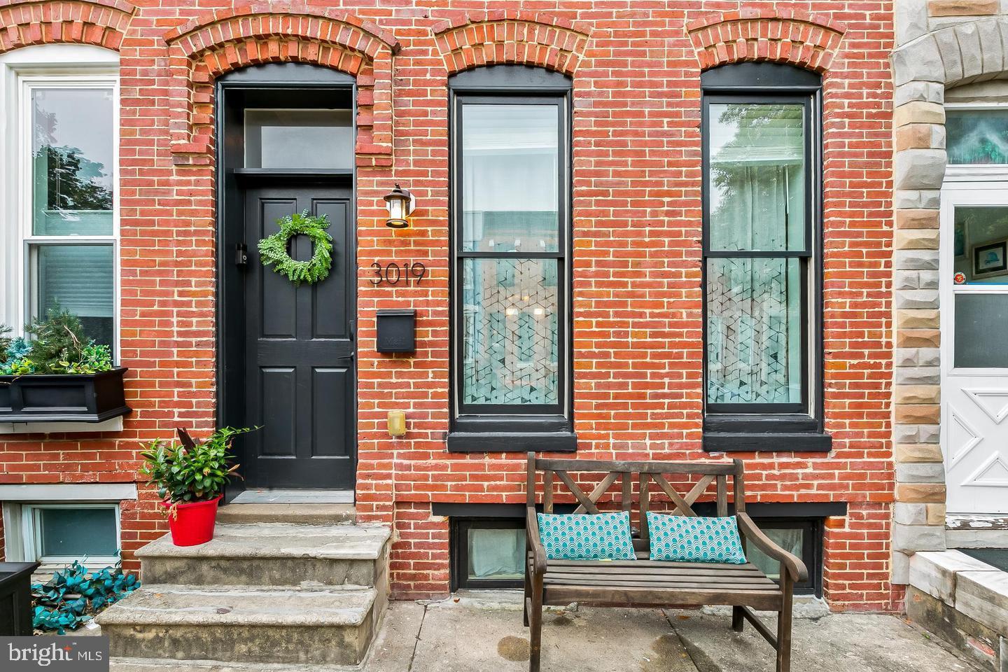Welcome to 3019 Keswick Rd, a beautifully updated home nestled in the heart of Hampden—one of Baltimore’s most sought-after neighborhoods known for its charm, character, and vibrant local scene. This 2-bedroom, 2-bath residence blends classic Baltimore style with modern upgrades, creating a warm and inviting space you’ll love coming home to.

Step inside to an open and airy floorplan designed for both everyday living and effortless entertaining. The gourmet kitchen is a true standout, featuring stainless steel appliances, gleaming countertops, and eye-catching exposed brick accents that add a touch of historic charm. The seamless flow between living, dining, and kitchen spaces makes hosting a breeze.

Upstairs, the spacious primary suite offers a relaxing retreat with vaulted ceilings that enhance the sense of space and light. The ensuite bathroom is timeless and elegant, complete with a classic subway-tiled shower with a rain head and striking black-and-white hex tile flooring.

A full-width, full-length basement provides exceptional storage and future potential. Featuring a finished laundry area with washer and dryer, the remaining unfinished space offers flexibility for storage, hobbies, or future expansion.

Outdoor living is just as impressive. Enjoy your morning coffee or unwind in the evening on the covered back deck, perfect for year-round entertaining. The fully fenced rear yard provides privacy and a rare bonus—backing directly to Wyman Park for peaceful, tree-lined views and easy access to nature.

With its unbeatable location, stylish finishes, and thoughtful features throughout, this Hampden gem offers the perfect blend of city living and everyday comfort. Don’t miss the opportunity to make it yours!