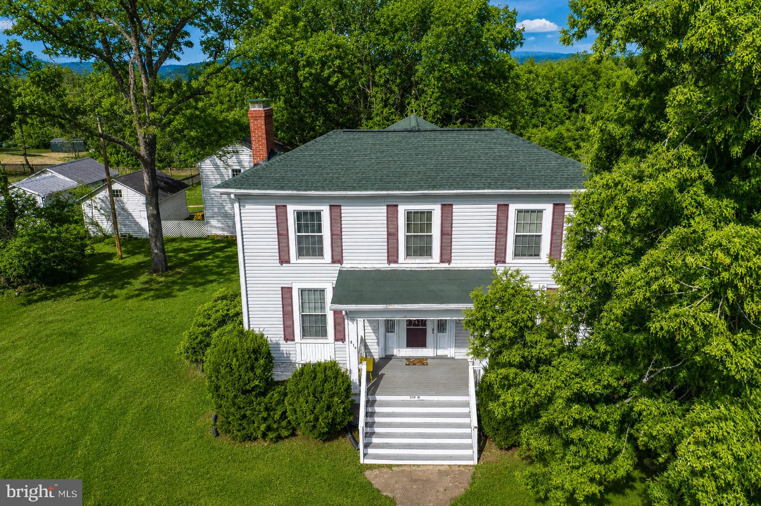 Circa 1840 | A Timeless Madison Treasure

Step back in time and own a remarkable piece of Madison’s history. Constructed around 1840 by John Richard Gooding and proudly featured in The Historic Homes of Madison, this well-maintained Colonial residence pre-dates the Civil War and is rich with architectural character and enduring charm.

From the moment you arrive, the classic columned front porch and double front doors with a transom window set the tone for what awaits inside. Beautiful Heart Pine and Oak floors run throughout the home, complemented by crown molding, original woodwork, and six fireplaces (currently sealed) that reflect the craftsmanship of a bygone era.

Inside, you’ll find a grand foyer, a cozy family room with wood stove, and a formal living room. The large country kitchen offers abundant cabinetry and gathering space, while the sunroom provides a bright and peaceful retreat.

Front and rear winding staircases lead to three spacious bedrooms and a full bathroom, preserving the historic layout while offering comfortable living.

Outdoor living is just as special — a large deck connects to the original first Madison Schoolhouse, creating a truly unique extension of the property. Additional exterior features include a detached 1-car garage, woodshed, storage shed, oversized .80-acre lot, and a new roof for added peace of mind.

Ideally situated in the heart of Madison, conveniently located between Charlottesville and Culpeper, you can even watch the town parade from your own porch. Walking distance to grab a bite to eat.

 This is more than a home — it’s a legacy. Own a piece of history and make it part of your story