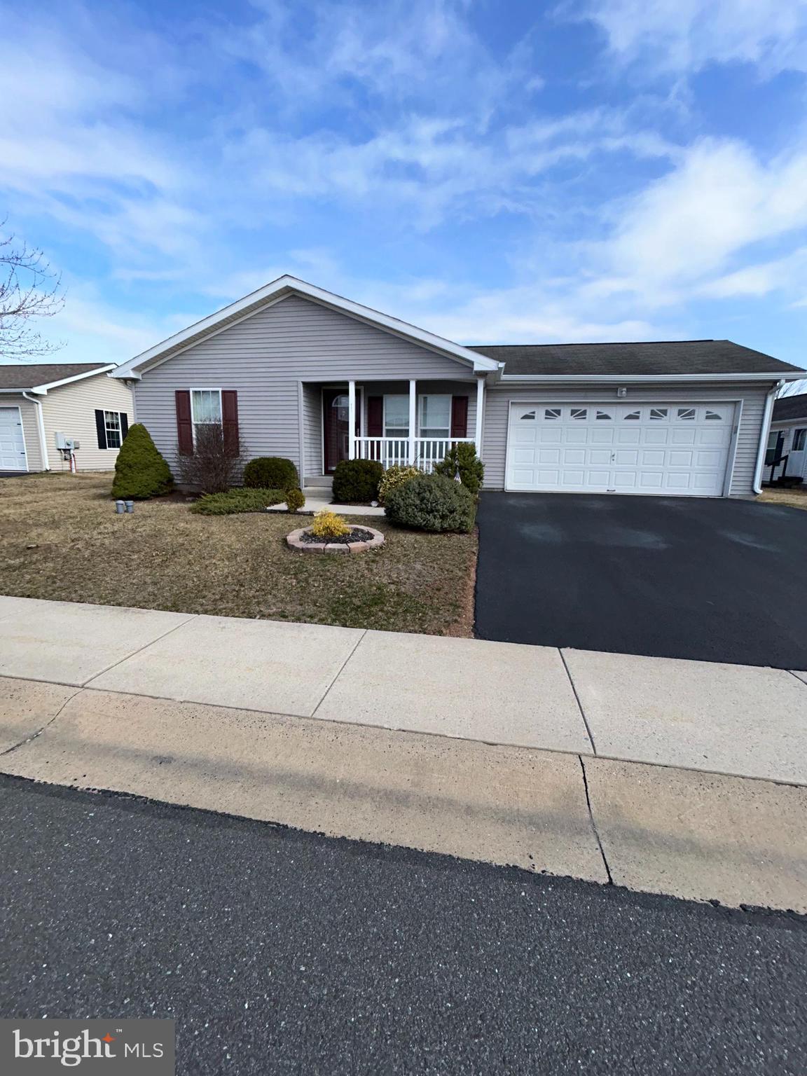Active Adult 55+ Community,!!HOME WARRANTY!! INCLUDED !! Location, Location steps away from Club house , pool and activities.,   Our popular Holly IV Model featuring Double Master Suites, Each suite has its own large closets with Bathroom attached, Walk in shower with bench seat, other has tub shower combo, both have full linen closets. Front Porch leads into Living Room that is open to the 25' Kitchen, approx 9' island, with open pass thru to Living Room.  Kitchen has an exit to Deck featuring private rear setting, also entrance to garage from kitchen.  Kitchen also has Dishwasher, Garbage disposal built in Microwave, Pantry, stainless steel sink and overhead lighting.  Laundry room with window and laundry tub.  2 entrances to Family Room from kitchen with honey comp window treatments, Stone gas fireplace with mantle, raised hearth with switch for blower and spot lights.  The community includes a Club House with game rooms, gathering room, gym, Kitchen and exterior Heated Pool.  Also included is grass cutting, snow removal and trash.  Take a tour to care free living, easy to show.