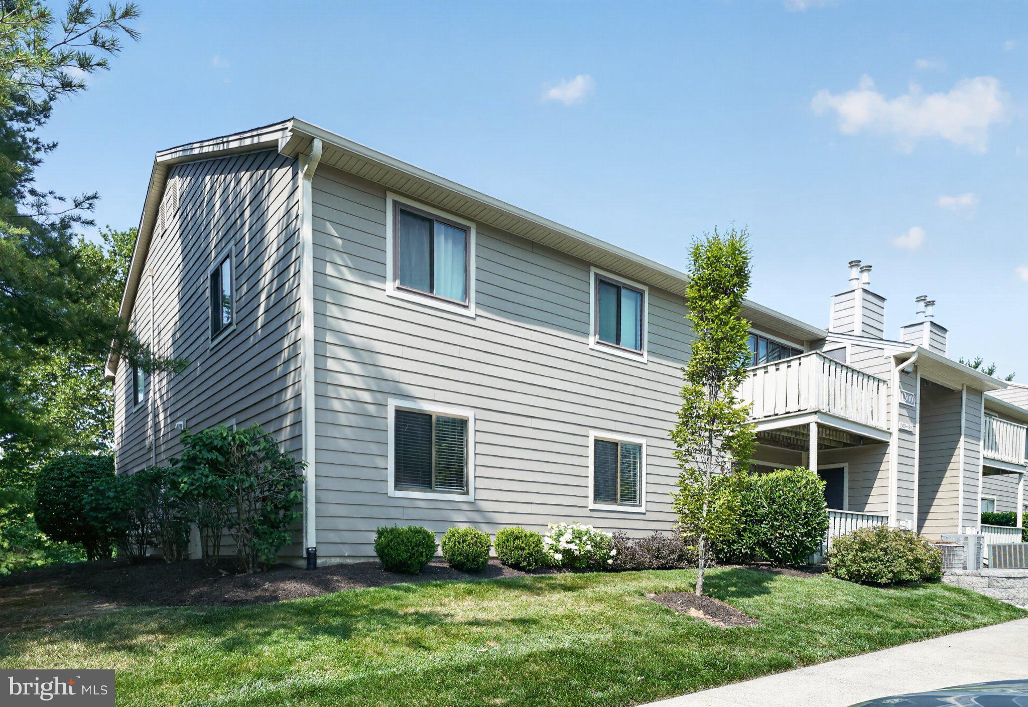 Fresh updates, first-floor convenience, and a private balcony come together in this inviting two-bedroom, two-bath condominium in the Wood Hollow community. Offering approximately 932 square feet, the home has been freshly painted and features new vinyl plank flooring throughout, creating a clean, cohesive look from room to room. The living and dining areas provide a comfortable setting for everyday living and entertaining, with access to the private balcony for a quiet outdoor retreat. The kitchen is conveniently positioned near the main living space.

The primary bedroom includes a private en suite bathroom and a walk-in closet, while the second bedroom offers flexibility for guests, a home office, hobbies, or additional living space. A second full bathroom completes the interior.

Wood Hollow offers a community swimming pool, tennis courts, basketball courts, and a playground, along with open areas and sidewalks for enjoying the neighborhood. Located in Montgomery Township with a North Wales mailing address and within the North Penn School District, the community is close to the Montgomeryville area's shopping and dining options. Routes 309, 202, and 463 are nearby, and North Wales Station provides SEPTA Regional Rail service on the Lansdale/Doylestown Line. Discover low-maintenance living with indoor comfort, private outdoor space, recreation, and convenient access to everyday destinations.