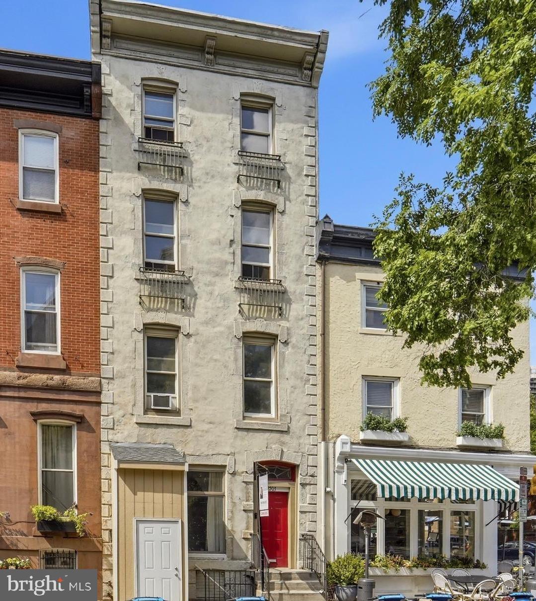 Located on one of Center City’s most coveted blocks, this exceptional circa 1850 architectural masterpiece offers a rare blend of grand scale, timeless elegance, and modern functionality. Spanning over four levels and approximately 3,500 square feet, this 6 bedroom, 6 bath home enjoys beautiful southern exposure, bathing its soaring ceilings and preserved historic details in brilliant natural light  The home sits within the highly sought-after Greenfield School Catchment.

Main Level: A traditional vestibule with a leaded glass window welcomes you into an expansive, open-concept living room featuring original hardwood floors, intricate crown moldings and preserved plasterwork. The seamless flow continues into the dining area and a spacious eat-in kitchen—complete with sliding doors that open to your private outdoor retreat. A convenient powder room and laundry complete this floor.

Second Level: An original, elegant, curved staircase leads to a spacious landing. The front bedroom features timeless wood built-ins and a pullman kitchen, while the bright rear bedroom boasts an ensuite bath and generous closet space.

Third Level: Two additional large, sun-drenched bedrooms are separated by a wide landing, offering an ideal balance of openness and privacy, and two full bathrooms.

Fourth Level: A versatile, expansive open area with a dedicated powder room—perfect for a family room, media lounge, or an additional bedroom suite—alongside an additional bedroom.  This floor also has a custom wood ceiling and views of the city skyline.

Lower Level: The partially finished basement with additional powder room and street entrance, provides exceptional storage space and opportunity to fully-finish if desired.

An Unbeatable Center City Location with a walk score of 100/100!!!
This home offers unparalleled convenience and pedestrian-friendly access to Philadelphia's finest amenities:
Institutions & Transit: Minutes from the University of Pennsylvania, Drexel University, CHOP, HUP, and Amtrak’s 30th Street Station.
Leisure & Culture: Just steps from the Schuylkill River Trail, local parks, charming cafés, and world-class dining and shopping destinations.
________________________________________
Note to Buyers: This historic treasure is being sold "as is," presenting a rare and remarkable opportunity to renovate and customize a grand Center City property into your absolute dream home.

Buyers and buyer's agents are responsible for independently verifying all real estate tax information, and square footage.