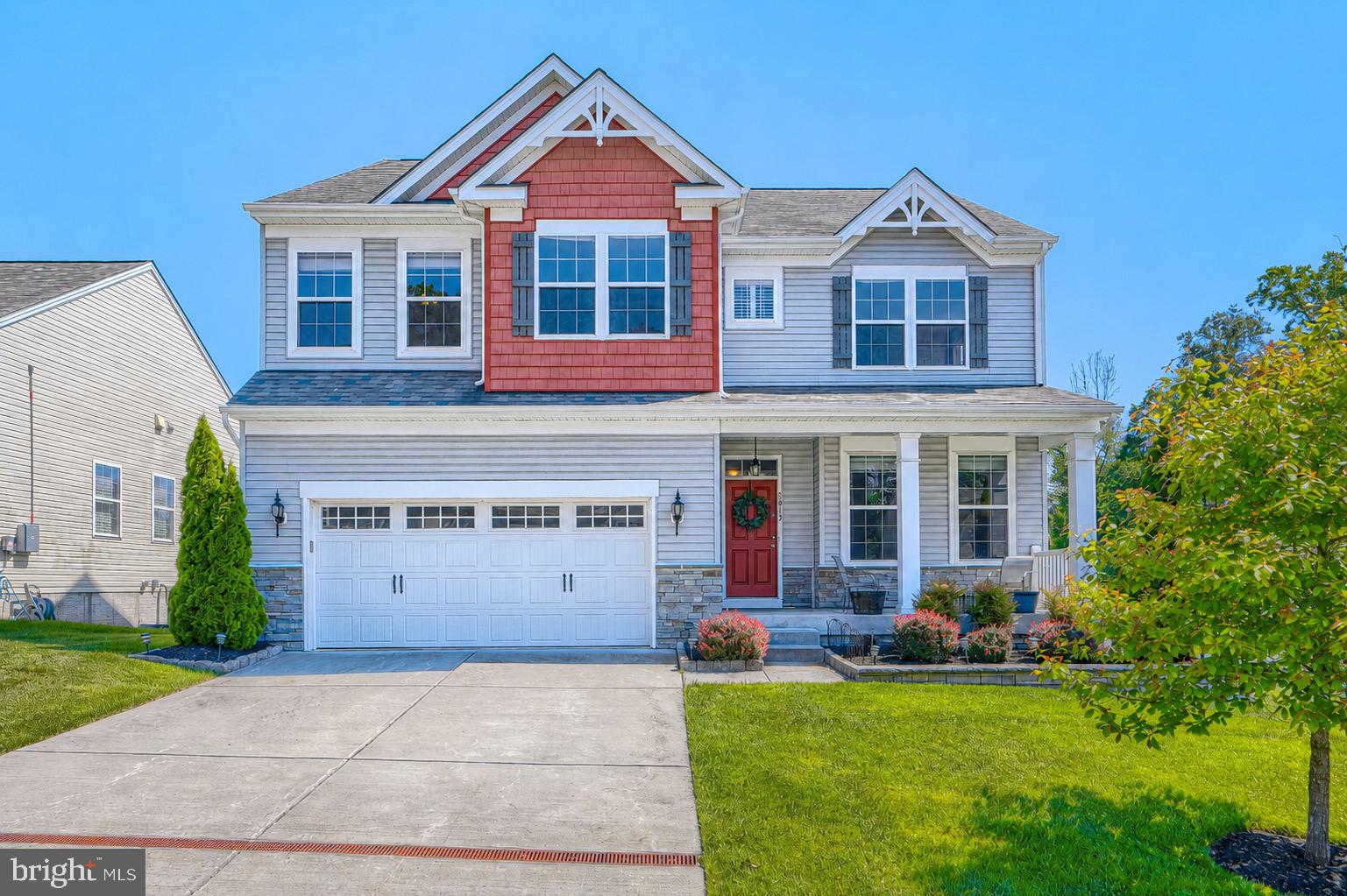 Welcome to this stunning 2019-built showstopper offering the perfect blend of modern luxury, functionality, and everyday comfort. Featuring 4 spacious bedrooms, 3.5 baths, and designer finishes throughout, this home is truly loaded with all the bells & whistles you’ve been searching for!

Step inside to an open-concept layout flooded with natural light, luxury flooring, recessed lighting, and a gorgeous stone fireplace anchoring the expansive family room. The gourmet kitchen is an absolute dream with oversized granite island, upgraded cabinetry, double wall ovens, gas cooktop, stainless steel appliances, under-cabinet lighting, and abundant prep/storage space — all seamlessly flowing into the dining and living areas for effortless entertaining.

The spacious primary suite offers a luxurious retreat, while the additional bedrooms and baths provide plenty of room for family, guests, or work-from-home flexibility.

Outside is where this property truly shines — enjoy your Trex deck overlooking a flat, fully usable backyard complete with custom hardscaping and patio space perfect for summer nights, gatherings, or simply relaxing.

From the charming front porch to the upscale finishes, thoughtful upgrades, and impeccable condition throughout, this newer build offers the feel of a model home without the wait for new construction. Conveniently located near shopping, dining, commuter routes, and more — this is the one you’ve been waiting for. Schedule today!