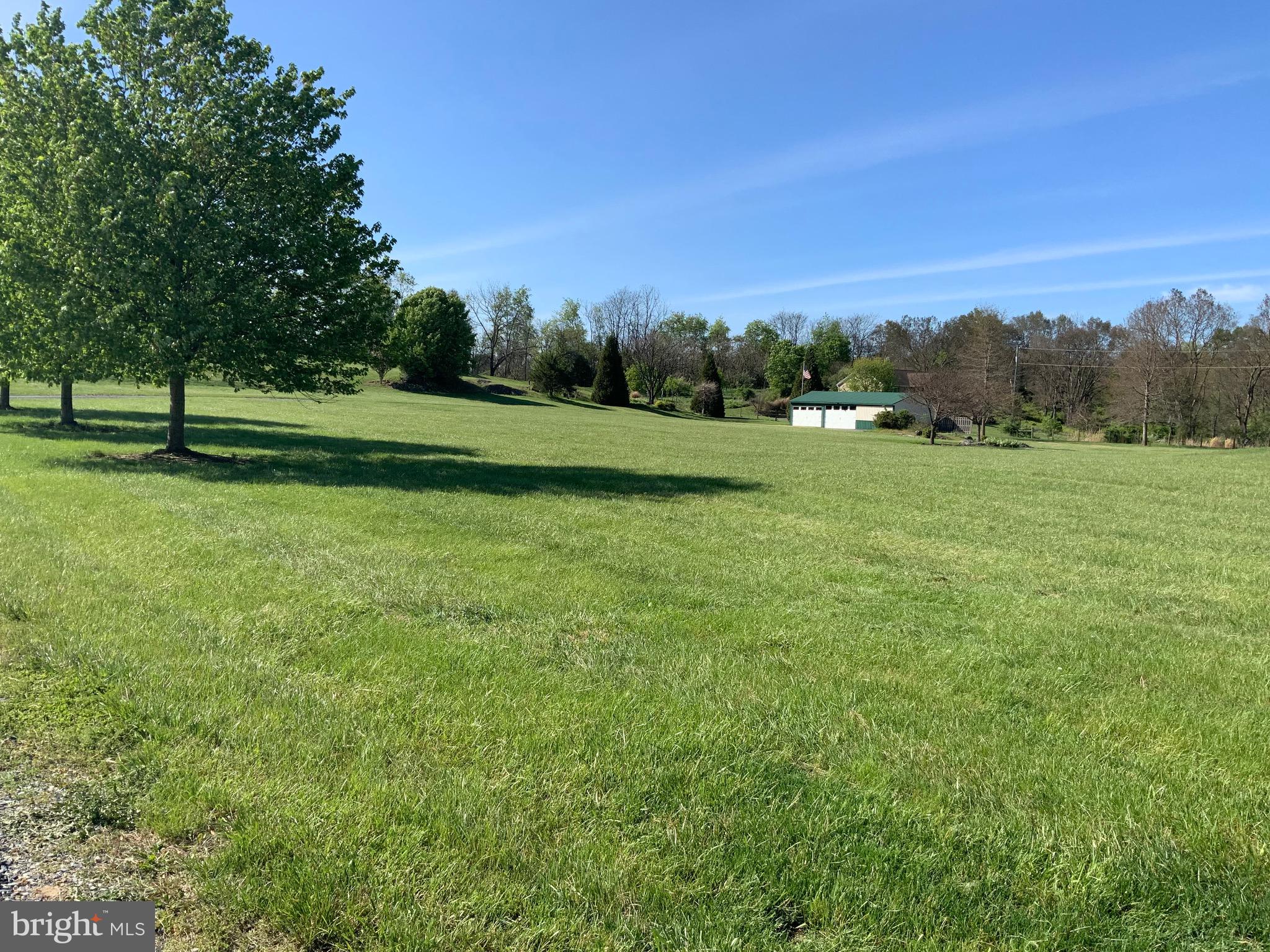 Beautiful 5 acre building lot for your dream house within minutes of Berkeley/Jefferson County line- only 3.5 miles from Shepherdstown WV, 7 miles from Martinsburg, and 14 miles from Charles Town. This lot is very lightly restricted (no mobile homes, no junk yards, no unlicensed vehicles), no HOA, cleared, completely fenced with gate, has existing well (2019) and standard septic approval, 300 gallon underground sewer storage tank for garage and camper use,  up to six car garage space with electric and water, mini split for heat/air, utility sink, and rough in for commode), outside hose, gravel driveway, conveniently located near schools, and shopping/dining options. Country setting yet close to all modern amenities, public transportation, Shepherd University and Cress Creek. Previous contract fell thru no fault on sellers side.