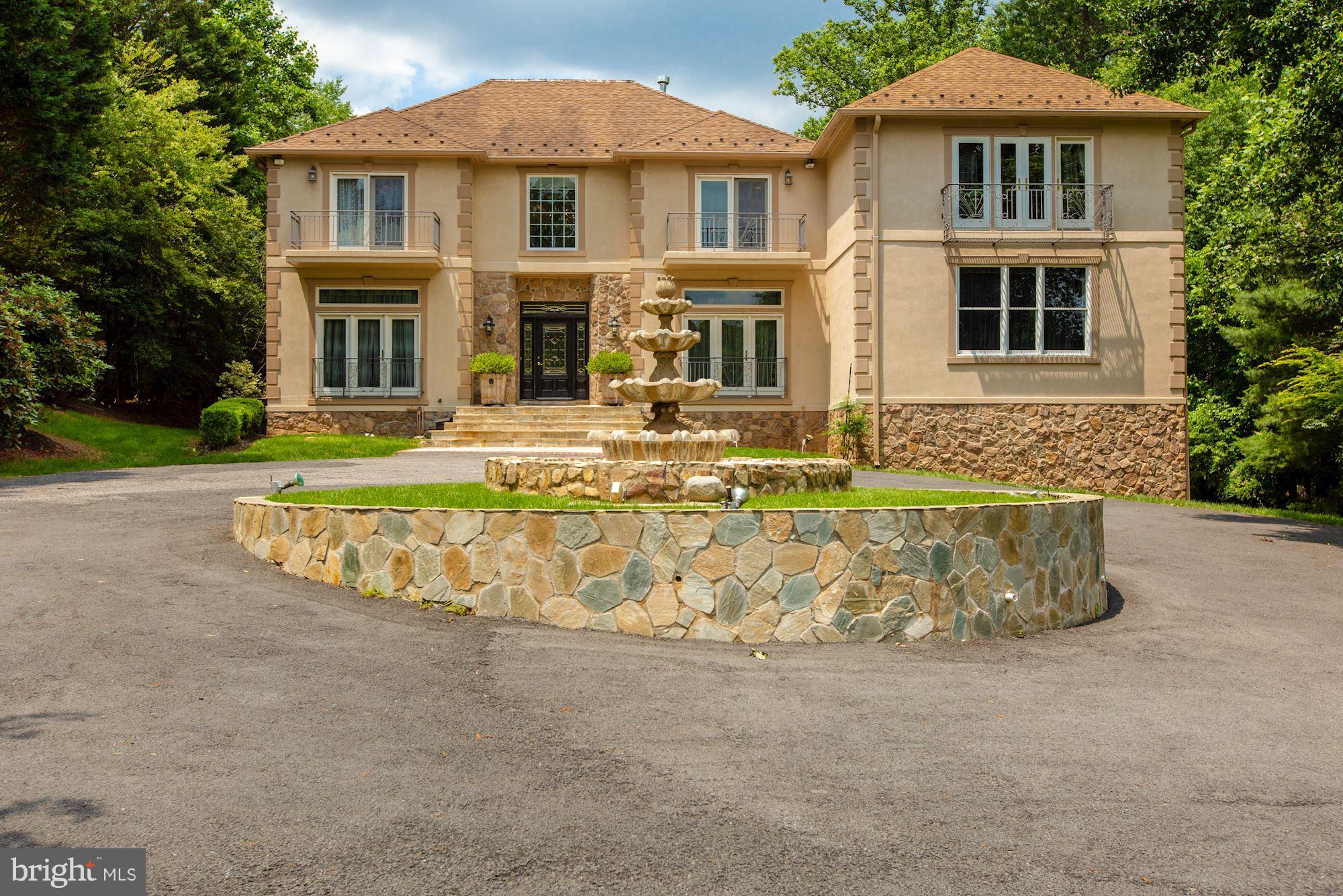 ***Please follow CDC guidelines. If you are sick or have a fever, please do not schedule a showing.*** A truly Great Home in Great Falls . Right out of a movie set of the Rich and Famous this home is set up for the entertainer in you. As you drive in the long circular driveway and pull up around the center water fountain with all kinds of up outdoor lighting you feel that you have arrived. Then as you step inside and you will see this is not your typical Northern Virginia colonial. The marble flooring throughout the formal living and dining rooms and elegant d cor set the stage. The Ebony stain on the hardwood floors and iron rails, and Venetian glass chandelier tell the story, this home was made for entertaining. The owner used the 1st floor master bedroom (one of three) as a main level gathering room, you can see from the pictures this was a fun place to hang out. It is easy to use as a main level master suite if you need that as well, you may want to take out the French door he added to the dining room. Then you come to the elegant full paneled library with corner fireplace and wet bar, this library has its own full bath. At the rear of the home you have a huge family room with entertainment center for your music and TV systems, fireplace and the ebony Hardwood floors. All open to a remolded and upgrade, top of the line kitchen. What home made to entertain doesn t have a 48-inch Wolf range, Sub Zero refrigerator, 4 ovens and a warming drawer. And that is in the main kitchen. There is also a catering kitchen with range as well. A huge pantry and wire cellar off the kitchen round out the main level. From the Kitchen and Family room you walk out to a killer patio / deck area that was made for spoiling your guests, the outdoor kitchen and siting areas lead to an inground pool and an expansive yard for optimum privacy. Close your eyes and you can see the large red umbrellas to shade your guest from the sun rays on hot summer months, or just look at the photos to get the feel. On the upper level you will find 4-bedroom suites all with private baths, and 2 large master suites with fireplaces, sitting room and large walk-in closets and Master baths with jacuzzi tubs and separate showers. As you move to the lower level you find the movie theater and bedroom with bath a recreation room with Bar and fireplace and the side load motor court with 3 car garages. As I said this elegant estate a real entertainer s dream!!
