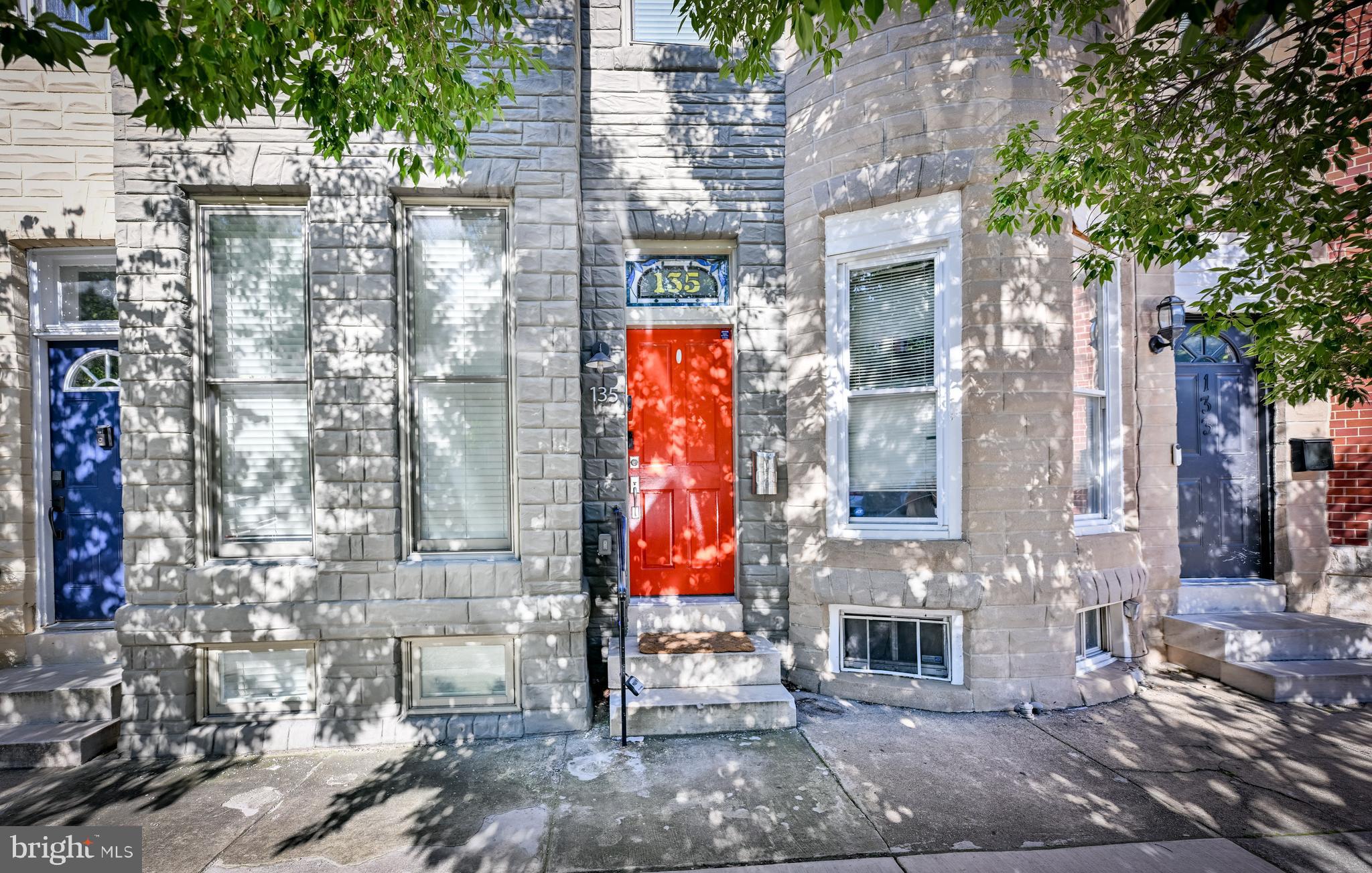 Welcome to 135 N Luzerne Ave nestled on a tree-lined street in the Patterson Park neighborhood, just a block and a half from Patterson Park. The main level has an open layout, spacious living and dining area, hardwood flooring throughout, a gourmet kitchen with an island, granite countertops, and stainless steel appliances. The back door leads to a low maintenance composite deck and fenced-in backyard patio, perfect for entertaining guests, grilling, or relaxing under the string lights. Upstairs, natural light pours through the hallway skylight. The large primary bedroom has a walk-in closet and an ensuite full bathroom. The second full bathroom is located in the hallway and the second bedroom has ample closet space as well. Downstairs you'll find a finished basement with high ceilings, a half bathroom, storage space under the stairs, and a large laundry room with a sink and a full size washer and dryer. Close to major commuter routes I95, I895 and I83, Johns Hopkins Hospital, Johns Hopkins Bayview, the shops, dining, and nightlife of Canton and Fells Point. A perfect place to call home!