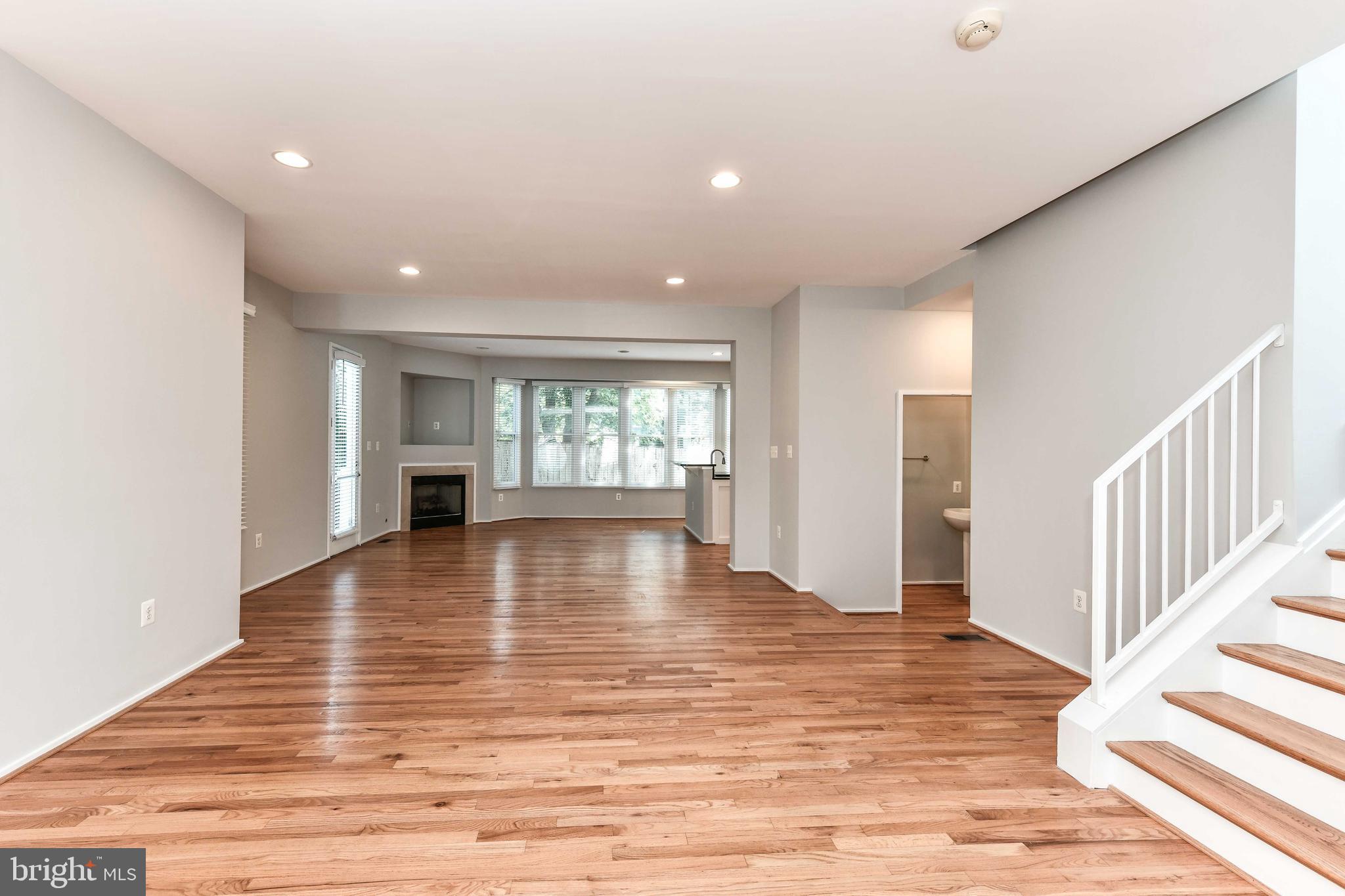 Beautiful 4BR, 3.5BA Contemporary Craftsman single-family home in Cherrydale just 2 lights to DC*Home boasts 2,900 sqft of living area on a 4,029 sqft lot with 1-car garage*Charming, large wrap-around front porch greets you as you enter the foyer to expansive, sophisticated floor plan perfect for entertaining*Built in 2004 & meticulously maintained, the main level features hardwood floors with 9ft ceilings, neutral paint tones, recessed lighting & lots of sunlight streaming through the many windows*Spacious living room, dining area & family room with large bay window & decorative gas fireplace*Kitchen features modern 42" wood cabinetry, granite counters with breakfast bar, pantry & stainless steel appliances*Fantastic side porch wraps around providing wonderful outdoor space for dining & BBQ*BBQ grill on porch has natural gas line installed that hooks up directly to house*Enjoy the BBQs on the spacious, fenced backyard with patio on level lot*Upper level features hardwood floors throughout*Primary suite featuring spacious room with treetop views for privacy, recessed lighting, large walk-in closet & ensuite bathroom featuring tiled floors & shower, large jacuzzi soaking tub & granite dual vanity*Two additional nicely sized bedrooms share updated full bathroom*All bedrooms have fans installed to help with comfort in the hot Virginia summer months! Lower level features hardwood & LVP flooring, recessed lighting, large rec room with patio door leading to backyard, office/den + full bathroom & large laundry room with washer & dryer plus extra storage*Energy Efficient 2-zoned HVAC is huge utility saver in  keeping top floor cool in summer & basement warmer in the winter*Bonus: This home is next to a small private park to enjoy some solitude or gather with friendly neighbors*Zoned for Arlington Science Focus School, Dorothy Hamm MS & Washington-Liberty HS*HOA includes landscaping, grass cutting, tree trimming, snow removal, semi-annual HVAC inspections + gutter cleaning*Stellar location! Just 2 stop lights to/from DC*Close to groceries, shopping, restaurants, gyms, parks, bike trails & entertainment*Short walk to the Ballston & Virginia Square Metros, Ballston Quarter & Clarendon*The convenient location provides easy access to major commuter routes, Rt. 50, 395*Minutes to Georgetown, DC & Crystal City, National Landing, Mclean & Falls Church, Tyson's Corner, Amazon HQ, Reagan National Airport & Pentagon*