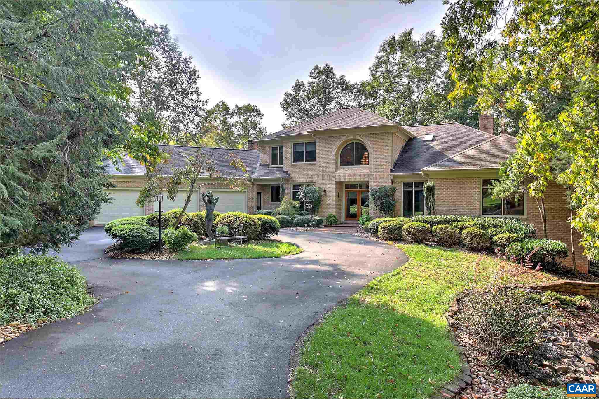 EXTRAORDINARY CUSTOM DESIGNED ALL BRICK HOME WITH A CONTEMPORARY INTERIOR FLAIR.   BUILT ATOP A CUL-DE-SAC LOT THAT OVERLOOKS  THE 18TH FAIRWAY BELOW AND OFFERS WINTER VIEWS OF THE RIVANNA RIVER.   OVER 7000 SQ FT OF FINISHED LIVING AREA THAT INCLUDES 5 BEDROOMS AND 5 BATHROOMS.  OTHER FEATURES INCLUDE CHERRY HARDWOOD FLOORING AND 9 FOOT CEILING HEIGHT ON MOST OF MAIN LEVEL, T & G CEDAR WOOD VAULTED CEILINGS IN BOTH FAMILY ROOM AND MASTER BEDROOM, 3 UPPER LEVEL SKYLIGHTS, LARGE WALK-IN CEDAR CLOSET, LARGE WET BAR WITH BUILT-INS IN LOWER LEVEL REC ROOM AND LARGE 3-CAR MAIN LEVEL GARAGE .  VERY PRIVATE AND PROTECTED HOMESITE.,Cherry Cabinets,Solid Surface Counter,Fireplace in Family Room,Fireplace in Living Room,Fireplace in Rec Room