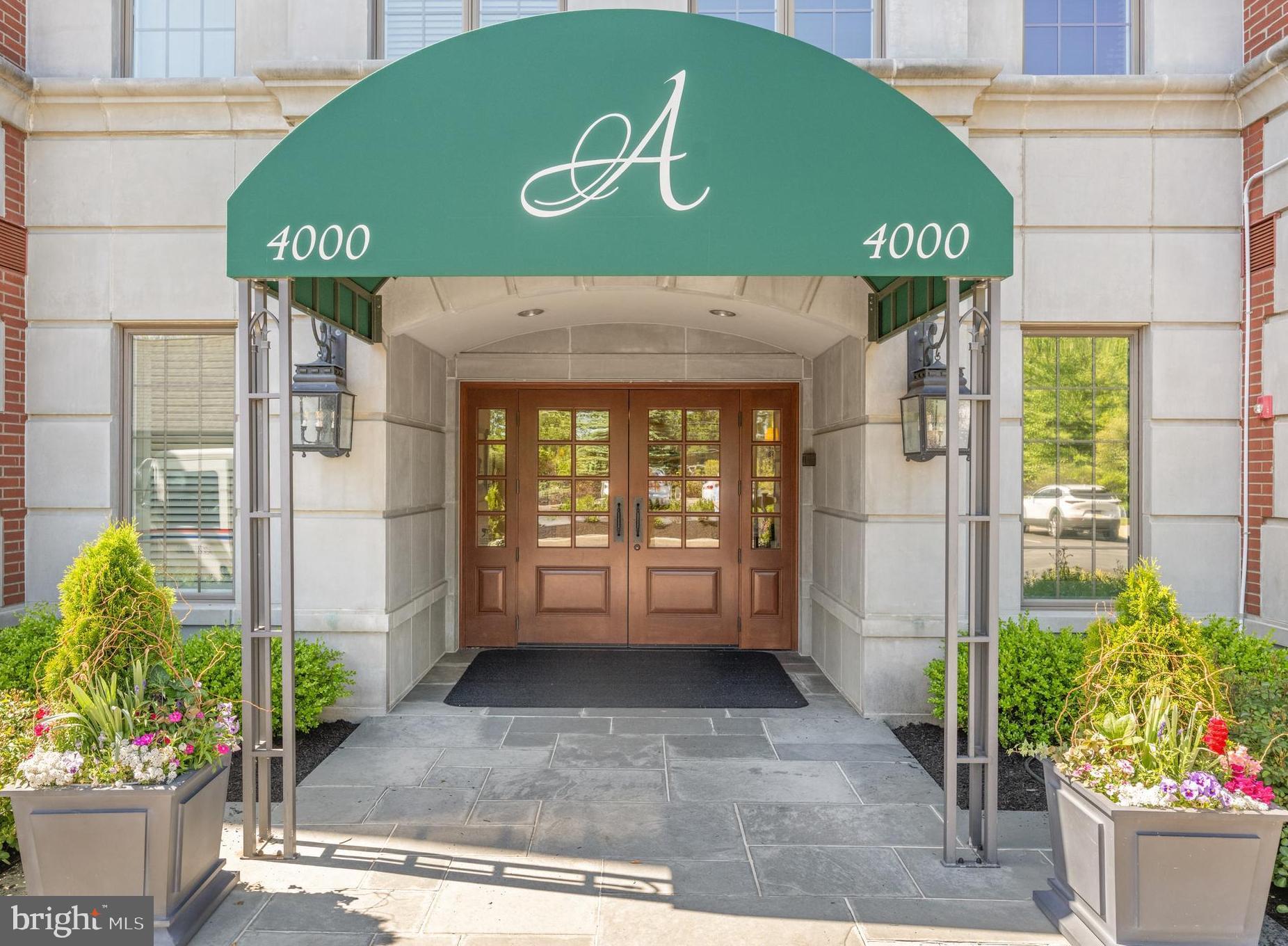 Welcome to Athertyn! This 2BR + Den, 2.5 Bath corner residence offers light-filled one-floor living with a private terrace overlooking the peaceful parkside setting of Haverford Reserve. From the moment you enter, you are welcomed by signature Pohlig craftsmanship, including double arched cased openings, crown molding, and finely detailed millwork carried throughout. The main living areas are enhanced by hardwood floors and a custom, floor-to-ceiling fireplace that serves as an inviting yet refined focal point. The gourmet Kountry Kraft kitchen, paired with a cozy breakfast nook, is both beautifully appointed and highly functional—ideal for everyday living as well as entertaining. Offering 2 bedrooms, 2.5 baths, and a full-sized laundry room, this home balances comfort with convenience. The primary suite provides a private retreat with generous walk-in closets and a spa-inspired bath featuring natural light, an oversized shower, and a soaking tub.   The den with custom built-ins adds versatility as a study, library, or home office.  The second bedroom with ensuited full bath is perfect for overnight guests or additional flex space.  At Athertyn at Haverford Reserve, residents enjoy the ease of low-maintenance living within a 209-acre community designed around preservation and natural beauty. Miles of walking and biking trails weave through the landscape, while exclusive amenities include a clubhouse, pool and spa, tennis/pickleball court, putting green, and gardens. Combining timeless architectural detail with the comfort and ease of single-level living, this residence offers a refined lifestyle in the heart of the Main Line.
