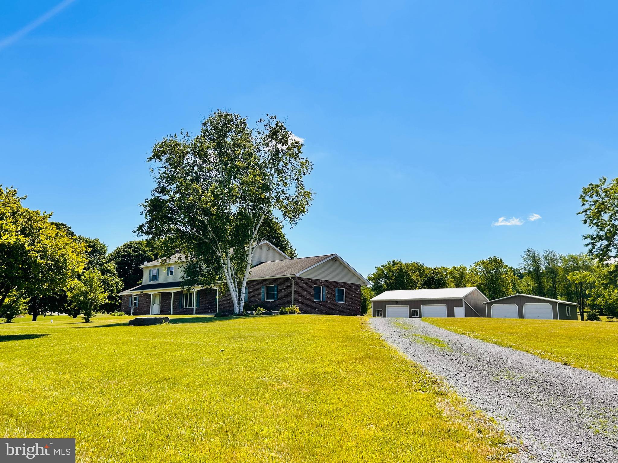 One of a kind treasure! Beautiful views and charming! You will love the welcome home feel of this Penns Valley beauty. Nestled on a 4.3 acre lot, this spacious two story home has been lovingly maintained. Step inside and be greeted by the country charm of open fireplaces, tile and wood floors, galley style kitchen with lovely wood cabinetry. Huge family room area for gathering with family and friends. Formal dining area with slider to extensive hardscape patio off the kitchen.  Upstairs you'll discover an expansive primary suite with two walk-in closets and a large private bathroom. Three additional bedrooms and a full bath provide plenty of room for your family or guests. Oil furnace is currently used for heating the water only but could easily be reconnected to be used as a back up heat source as well. Need garage space?? This home has 2 garages with room for 4 vehicles, the attached garage even has a heated floor! Another 24x24 shed with garage style doors has been used by the seller in the past for parking spare vehicles. Fenced back pasture area perfect for a horse! You will love this special home, inside and out!  Conveniently located close to State College/Campus, wineries, shopping and schools,  bringing the perfect fusion of country living with the easy access to town! Schedule your tour today!