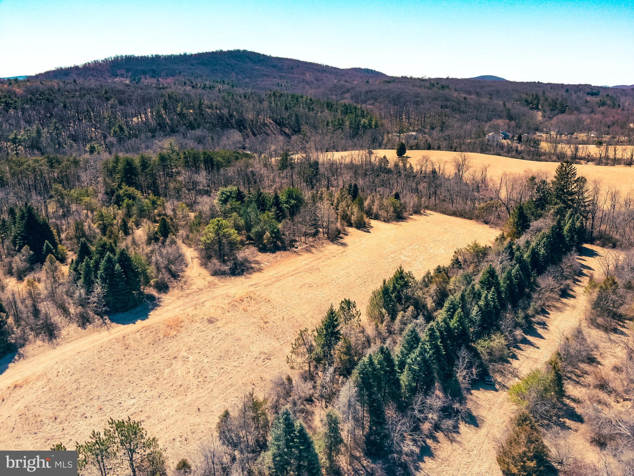 ***OFFER IN HAND. ALL OFFERS DUE BY MONDAY, 3/31/2025 AT 12PM. OFFERS BEING PRESENTED MONDAY AFTERNOON*** Welcome to your private 15.3-acre retreat in Perry County, located within the Newport School District. This diverse parcel offers a mix of open field and timber, ideal for anyone looking to build, hunt, or simply escape. With no zoning restrictions, your options are wide open—whether it’s a dream home, hunting camp, or weekend getaway. A recorded, shared driveway is already in place, maximizing usable land and eliminating the need to construct a new entrance.

Losh Run meanders through the rear of the property, adding to the peaceful setting and offering a cool place to relax or explore. A well-established trail system makes it easy to navigate on foot or ATV. You’ll find pine thickets ideal for deer bedding, abundant wildlife sign, and proven whitetail and turkey activity, making this a hunter’s paradise. Shallow shale outcroppings add character, and surface, oil, and gas rights convey.

The property features stunning mountain views to both the north and south, and it’s only minutes from PA State Game Land 281 and the confluence of the Juniata and Susquehanna Rivers, an area known for incredible fishing and outdoor recreation. Whether you want to set up a camper, build your dream home, or simply get away from the hustle of everyday life, this property offers it all—privacy, beauty, and endless potential.