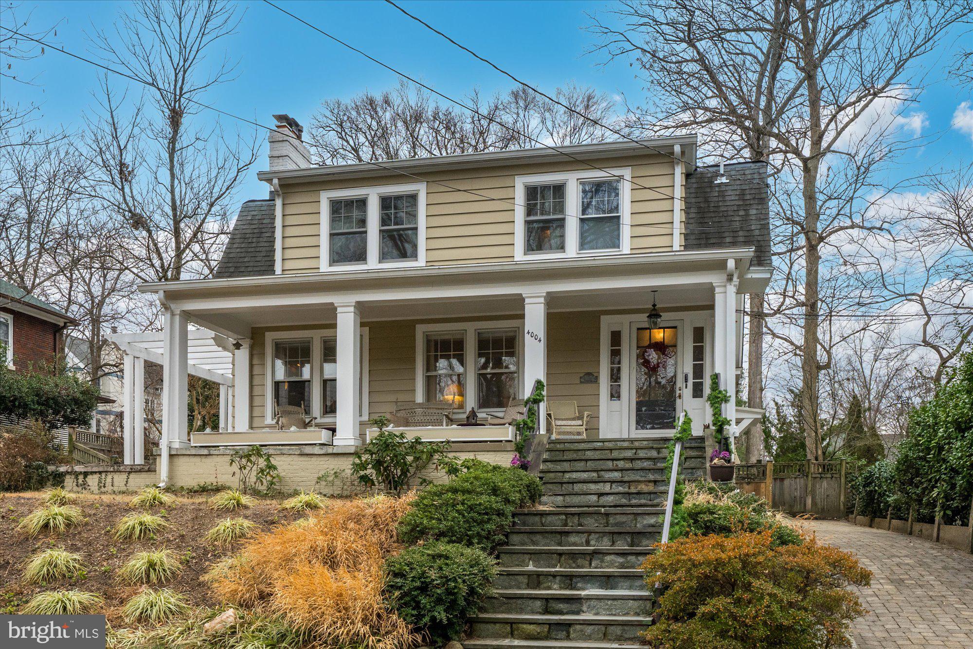 Charming, sun-filled Chevy Chase bungalow offering 4 bedrooms, 3 full baths, and 1 half bath, plus a rare 25’ x 25’ detached studio with a sink and fridge, an additional full bath, and heating and air conditioning—ideal for a home office, gym, or creative space. This inviting home features flexible living areas and exceptional indoor-outdoor amenities. The bright main level showcases a spacious living room with a fireplace, a separate dining room, hardwood floors, and a cheerful country kitchen with an island, top grade appliances, and generous table or sofa space. A convenient powder room and a glass-enclosed heated porch/den complete the level. Upstairs, the private primary suite features an en-suite bath with dual sinks and a walk-in shower, complemented by two additional bedrooms and a full hall bathroom. The full basement expands the living space with a complete in-law apartment, including a full kitchen, bedroom, bathroom, recreation room, and separate entrance —ideal for guests or extended family. Enjoy outdoor living with a welcoming front porch, and a backyard with a two level stone patio and ample lawn space with raised garden beds, perfect for entertaining or play.  Additional highlights include a private driveway and a prime location convenient to parks, playgrounds, shopping, and restaurants.