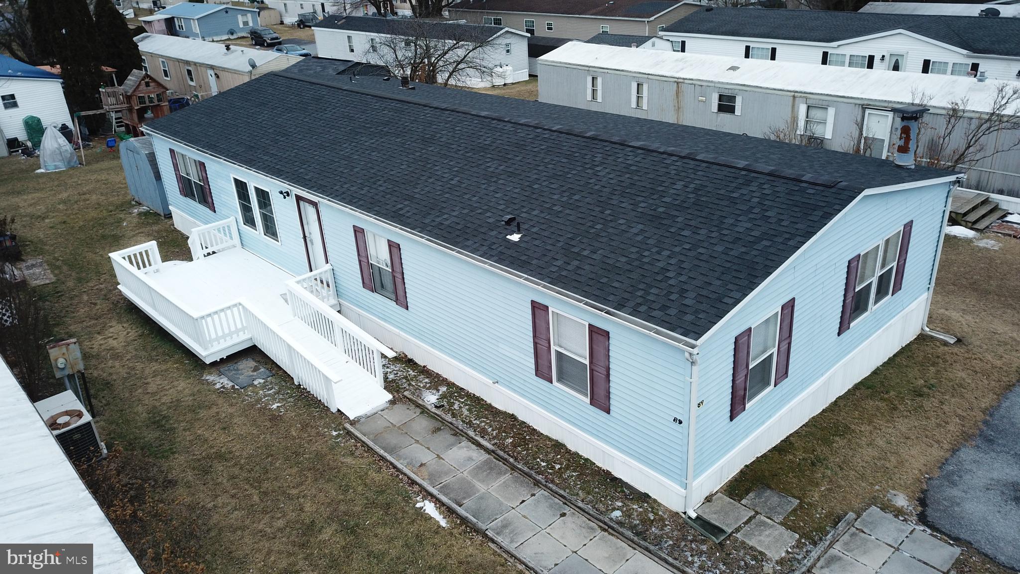 Spacious double wide mobile home in Grantville Commons. This property has many New upgrades including a Brand NEW ROOF with 30 year architectural shingles! 3 large bedrooms w/New carpet with 2 full baths. Both Baths were completely renovated. Master bath features a brand new garden tub. Family room with wood burning fireplace, 2nd living space or office, outside shed, newer central air/heat pump w/electric emergency heat back up. Off street paved parking for 2 cars. Freshly paint throughout & new LVP Flooring in the main living spaces. Lot rent includes water, sewer, and trash. Conveniently located near highway access and across from the Hollywood casino. Must be approved by park. This property is owned by the real estate agent.