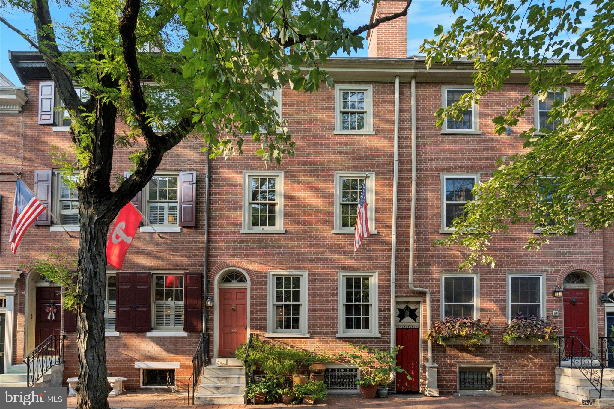 This wonderful home is in the heart of the Society Hill neighborhood of Philadelphia and is available for the first time in almost 60 years! Two tax parcels are included, 515 Delancey St & 518-520 Cypress St.  The 60’+ deep garden brings to mind the scenic beauty and timeless elegance of the Tuscan countryside and has fenced-in parking for 1+ cars. The property expands a full city block onto quiet streets, full of history and a strong sense of community. You’ll notice right away that this historic home’s brick façade has been repointed. The roof was replaced in 2019, and it has five working wood burning fireplaces and newer windows. 

Entering from Delancey St, you're welcomed into a spacious living room with a fireplace, which leads to the kitchen, dining room, and a full bath. The Dining room 2016 addition, including a full bath, is open to the kitchen with a center island, stainless steel appliances, and a Vulcan range/salamander. It is flooded with light from skylights, tall windows, and French doors to the spectacular garden for entertaining and relaxing. The garden has a beautiful arbor with grape vines creating a natural canopy for a large table for friends and family to gather for meals and parties, mature plantings, and flower beds. There is fenced in parking into the garden from the additional lot on Cypress St. 

The second floor has a large bath with laundry and a large bedroom each with a fireplace. There are two additional bedrooms with fireplaces on the third floor. The front bedroom boasts hand crafted wall to wall cherry wood bookshelves. The top floor (attic) has a spacious workspace with natural sunlight. The basement houses utilities, a full bath, built-in bed and built-in sofa. 

Walking score 97, Bike score 84, and Transit score 100. Supermarket and Pharmacy are conveniently located on 5th St. Washington Square Park, Pennsylvania Hospital, and Independence Mall are close by.  Located in the McCall Catchment. Convenient to Rte. 676 and I95.
