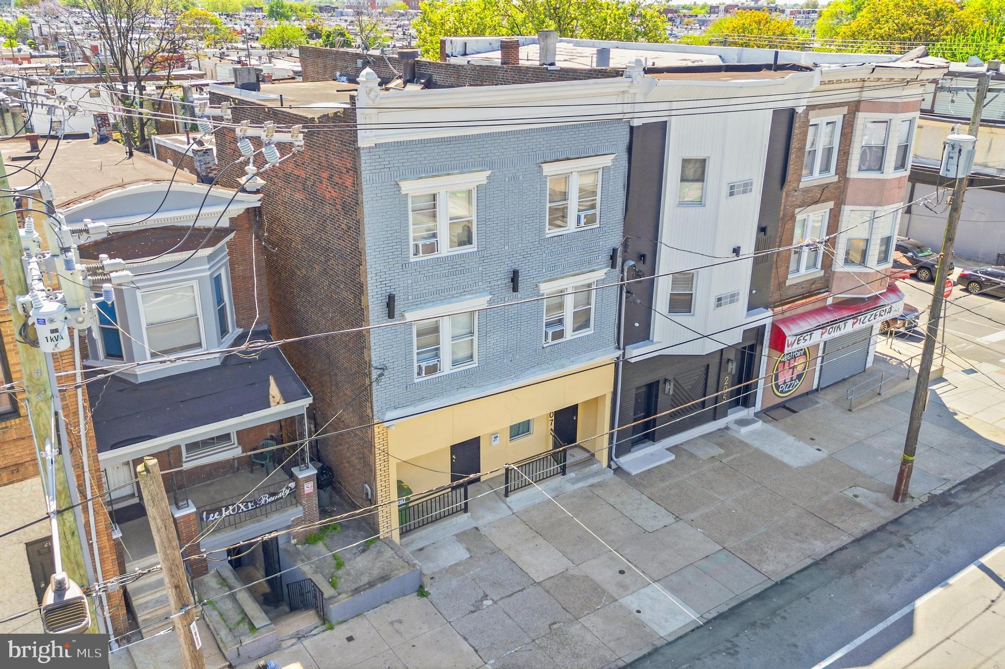 207 N 63rd Street is a turn key, rent ready 7-unit multifamily building offering strong in-place income with additional development upside in West Philadelphia’s Cobbs Creek/Haddington corridor. The property features two 2-bedroom, 1-bath units and five 1-bedroom, 1-bath units, with all seven units currently operating as a furnished mid-term rental program generating approx $10,000 per month gross income. For investors seeking a traditional multifamily model, the property also offers a long-term rental pro forma of approximately $8,000 per month. With no long-term leases to assume, the next owner has flexibility to continue the existing operation or transition the building to conventional multifamily use.

The building has been thoughtfully updated with a new roof, updated mechanical systems, finished kitchens, updated bathrooms, and design-forward accent finishes throughout. The units are fully furnished and rent-ready under the current boutique rental program, creating a seamless opportunity for an investor looking to continue the existing cash-flowing operation. The current operating structure may also be transferable, including pricing strategy, rental platform setup, cleaning vendors, and turn protocols.

The lot goes street-to-street with a 225' deep lot, which may support a potential development opportunity to build an additional apartment building behind the existing structure, subject to buyer verification of zoning, approvals, and feasibility. This creates a unique opportunity to acquire stabilized in-place income while exploring future development potential.

Located near the Market-Frankford Line at 63rd and Market Station, the property offers convenient access to Center City, University City, Drexel, Penn, CHOP, and surrounding employment and education hubs. 

Available individually or as part of a package with 211 N 63rd Street, a 5-unit property listed separately for $490,000. Buyers may submit offers on either building independently or the 12-unit portfolio. Tours by appointment with 48 hours’ notice.