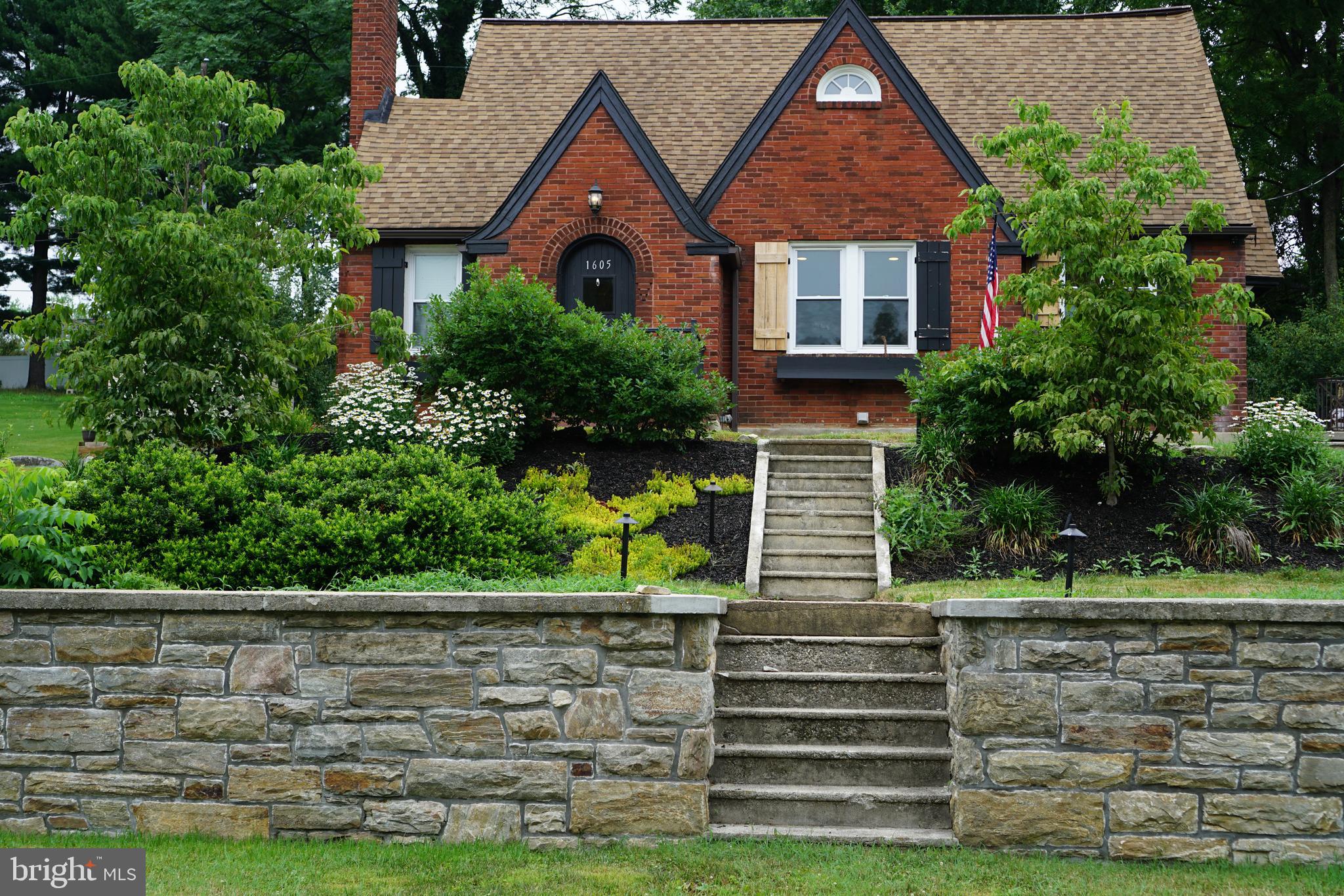 Welcome home to this charming all-brick Cape Cod, where timeless 1930s character blends beautifully with thoughtful modern updates. From the moment you arrive, you'll appreciate the exceptional curb appeal, mature landscaping, and driveway leading to a rear parking pad. The professionally installed retaining wall creates one of the few level backyards in the neighborhood, providing a spacious and functional outdoor retreat. The backyard is perfect for relaxing or entertaining with a generous deck, inviting patio, raised garden beds, and a brand-new storage shed.

Inside, the main level offers the convenience of one-floor living with two spacious bedrooms and a full bathroom. Newly refinished hardwood floors extend throughout the living and dining rooms, creating warmth and continuity. The inviting kitchen features granite countertops and opens directly into the dining room, making everyday living and entertaining effortless. The living room is centered around a fireplace that can be restored to its original wood-burning charm or converted to a gas insert. A welcoming front vestibule provides a convenient place to leave coats, shoes, and everyday essentials.

The upstairs primary suite is the home's true showpiece. This private retreat includes a spacious bedroom filled with natural light, a full en-suite bathroom, a walk-through closet, and a comfortable sitting area that also works beautifully as a home office or reading nook. Multiple windows and dedicated climate control ensure comfort throughout the year.

The basement includes a partially finished room with plumbing in place for a future bathroom, along with a large unfinished area that provides abundant storage, laundry space, and room for a workshop or hobbies.

Tucked away just off Columbia Avenue, this home offers the perfect balance of convenience and privacy. Major roadways, shopping, dining, healthcare, and downtown Lancaster are all just minutes away, yet the neighborhood feels quiet, established, and pleasantly removed from the hustle and bustle.

Lovingly maintained and full of character, this beautifully appointed Cape Cod combines classic craftsmanship with practical updates to create a home that is both comfortable and inviting. With its unique blend of charm, functionality, and an unbeatable location, this is a home you'll enjoy for years to come.
