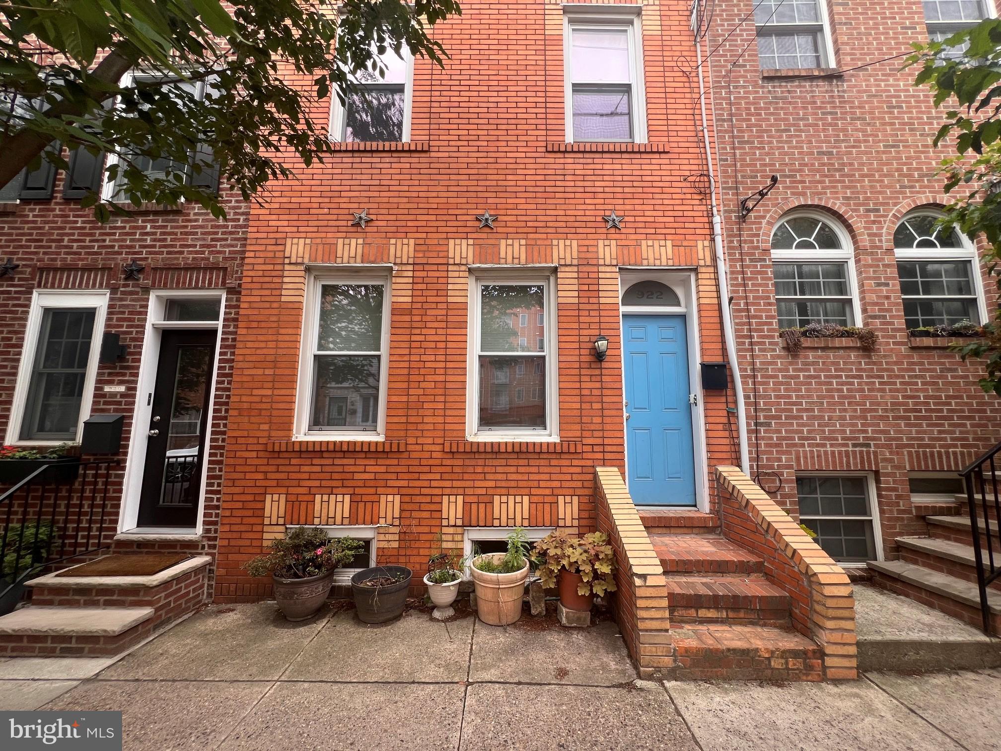 Welcome to 922 Ellsworth Street, a fantastic duplex opportunity in the heart of Bella Vista and the iconic Italian Market section of South Philadelphia. Whether you're an investor looking for solid rental income or an owner-occupant seeking the perfect live-in investment, this property offers flexibility, character, and an unbeatable location.
The first-floor unit is a one-bedroom, one-bath residence with convenient single-level living and access to a private rear yard. The full basement houses the mechanical systems along with a dedicated washer and dryer for the unit. Currently tenant-occupied by a resident who would like to remain, this apartment offers immediate income potential while providing an opportunity for future cosmetic updates and value enhancement.
The second unit occupies the second and third floors and is filled with charm and artistic character. As you enter the building and ascend the stairs, you'll find unique mosaic artwork flowing inward. The second floor features an open-concept living space with exposed wood beams, exposed brick walls, abundant natural light, a galley kitchen, and excellent storage throughout.
The third floor offers two spacious bedrooms, including a front primary bedroom and a rear secondary bedroom. From this level, you'll access the expansive rooftop deck spanning the entire roof footprint. Enjoy breathtaking 360-degree views of the Philadelphia skyline, creating the perfect setting for entertaining, gardening, or simply relaxing above the city.
The property features separately metered utilities, with each unit having its own heating system, hot water heater, and washer and dryer, making management simple and efficient.
Situated on a desirable tree-lined block, 922 Ellsworth is just steps from the Italian Market and surrounded by some of Philadelphia's best restaurants, cafes, bars, specialty shops, and neighborhood amenities. Convenient access to public transportation, Center City, and major highways makes this location as practical as it is vibrant.
A rare opportunity to own a character-filled duplex in one of Philadelphia's most sought-after neighborhoods.