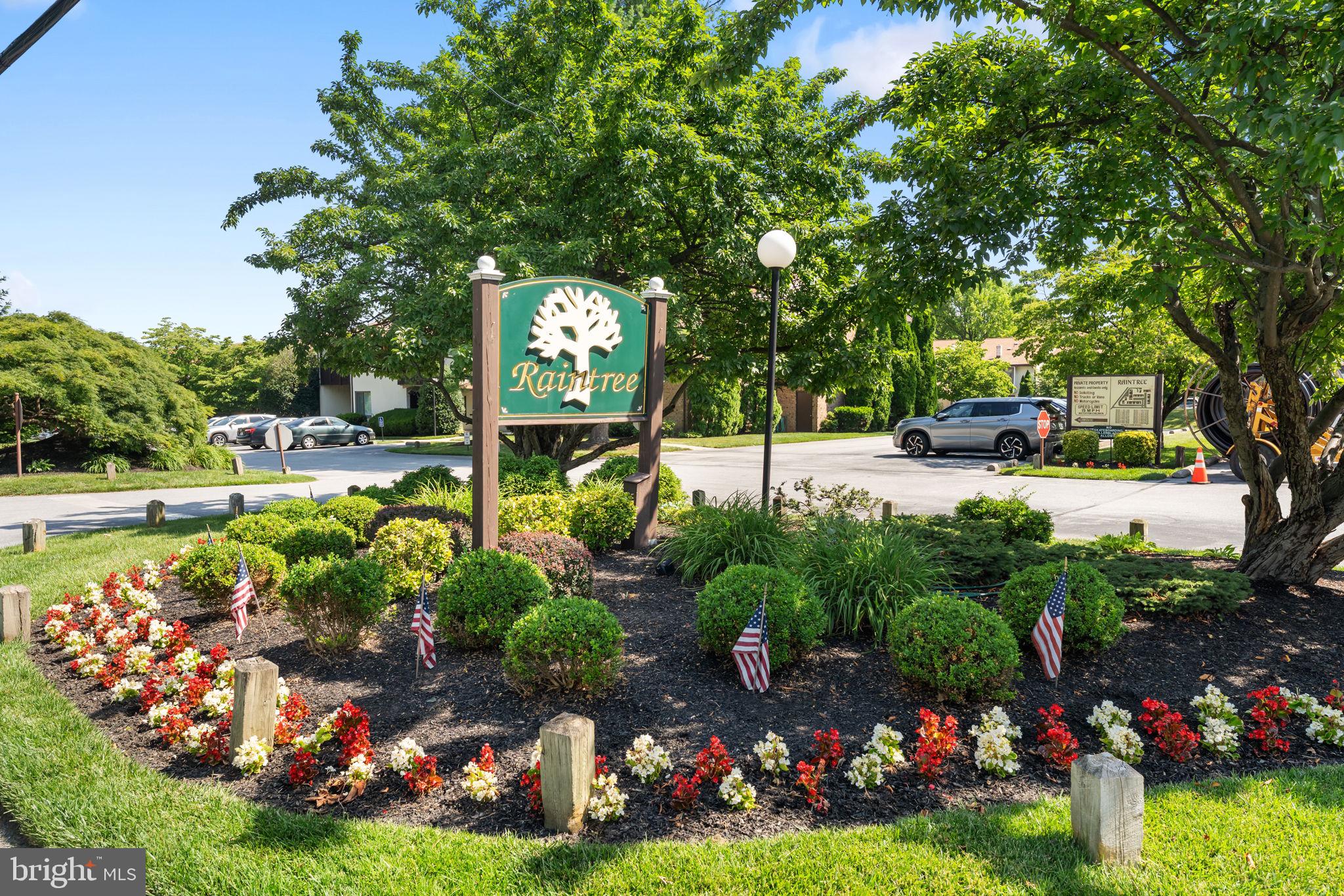 Welcome to 108 Raintree Lane, a beautifully maintained 2-bedroom, 1-bath upper-level condominium in the highly desirable Raintree Condominium Association, ideally located in the heart of Malvern Borough. Freshly updated with new carpet throughout, this bright and inviting home offers a spacious, functional layout. The sun-filled living room features soaring vaulted ceilings—a distinctive feature exclusive to the upper-level units—along with oversized windows and a sliding glass door that opens to the first of two private balconies. This outdoor space also provides access to both the utility room and a convenient exterior storage closet. The adjoining dining area flows seamlessly into the generously sized kitchen, creating an easy space for everyday living and entertaining. Down the hall, you'll find a comfortable secondary bedroom with a large closet and abundant natural light. The spacious primary bedroom features a walk-in closet and direct access to the second private balcony, offering a peaceful place to enjoy your morning coffee or unwind at the end of the day. Additional storage is a standout feature of this home, including a dedicated interior storage room (shown on the floor plan), a large linen closet, and a side-by-side laundry closet. Building 1 enjoys one of the community's most convenient locations, just steps from Raintree's gated pool complex featuring a large swimming pool, children's wading pool, and plenty of lounge seating with tables and umbrellas for relaxing all summer long. Beyond the community, you'll love the lifestyle that comes with living in Malvern Borough. Located within the award-winning Great Valley School District, this home is just a short stroll to the borough's parks, public library, popular weekly farmers market, local shops, restaurants, cafés, and the train station, making commuting to Philadelphia and beyond simple. **Please note: Raintree Condominium Association does not permit investors, dogs, motorcycles, trucks, or gas grills. Indoor cats are permitted in accordance with association rules.**