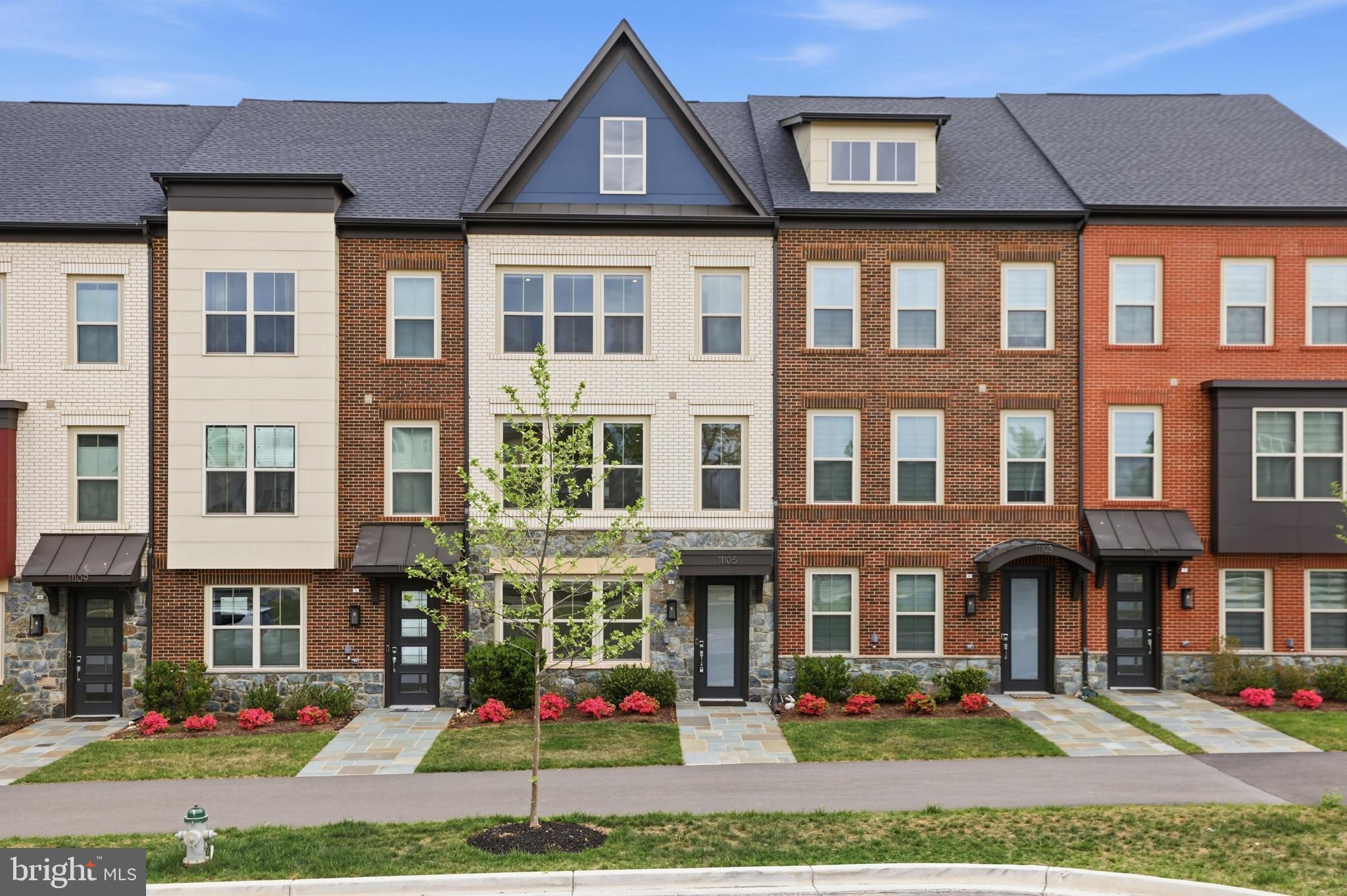 PRICE IMPROVED! over $110,000 NSTANT EQUITY OPPORTUNITY! 

This is your RARE OPPORTUNITY to own a BRAND NEW, NEVER-LIVED-IN, and 100% TURNKEY luxury townhome within the highly sought-after The Grove community! Skip the typical 8-10 months new-construction timeline. Built in 2024, this sought-after Westmore model with LOFT spans over 2,500 square feet of impeccably designed living space, featuring 4 spacious bedrooms and 4.5 designer bathrooms where every surface, finish, and appliance is untouched and pristine.

PREMIUM PRIVACY & POSITIONING Perfectly situated on a PREMIUM LOT, this home is deeply tucked within the community to offer enhanced PRIVACY and a serene COURTYARD VIEW - a significant upgrade over standard street-facing lots. Convenience is built-in with AMPLE GUEST PARKING directly in front and a private driveway for two full-sized vehicles.

CHEF’S GOURMET SANCTUARY The heart of the home is a culinary masterpiece featuring TOP-OF-THE-LINE BOSCH stainless steel appliances, upgraded SOFT-CLOSE cabinetry, and a beautifully selected, modern QUARTZ BACKSPLASH backsplash. An OVERSIZED ISLAND serves as the centerpiece for an open-concept layout that flows effortlessly into the living and dining areas, bathed in natural light.

VERSATILE & SOPHISTICATED LIVING The home’s footprint is designed for maximum flexibility. Enough space and rooms for HOME OFFICE, dedicated GUEST SUITES. Every corner has been thoughtfully designed and curated. 

The Upper-Level Loft: An EXPANSIVE, LIGHT-FILLED retreat featuring added SKYLIGHTS and its own full bathroom—perfect for a private guest suite, home office, or junior suite.

The Entry Level: Perfect recreation room or can be easily convertible into a 5th bedroom, creating an ideal, private in-law suite.

Spa-Inspired Baths: Each bathroom features curated and UPGRADED cabinet selections and FLOOR-TO-CEILING shower tile with UPGRADED FRAMELESS GLASS enclosures.

UNBEATABLE LOCATION & LIFESTYLE: WALK to TRADER JOE'S!  Enjoy the peace of a quiet enclave with the pulse of Rockville at your doorstep. You are minutes from RIO, Crown, Kentlands, and Shady Grove Hospital, FULL Community amenities include a designer clubhouse, fitness center, and pool, dog park and walking trail.

This rare opportunity won't last!