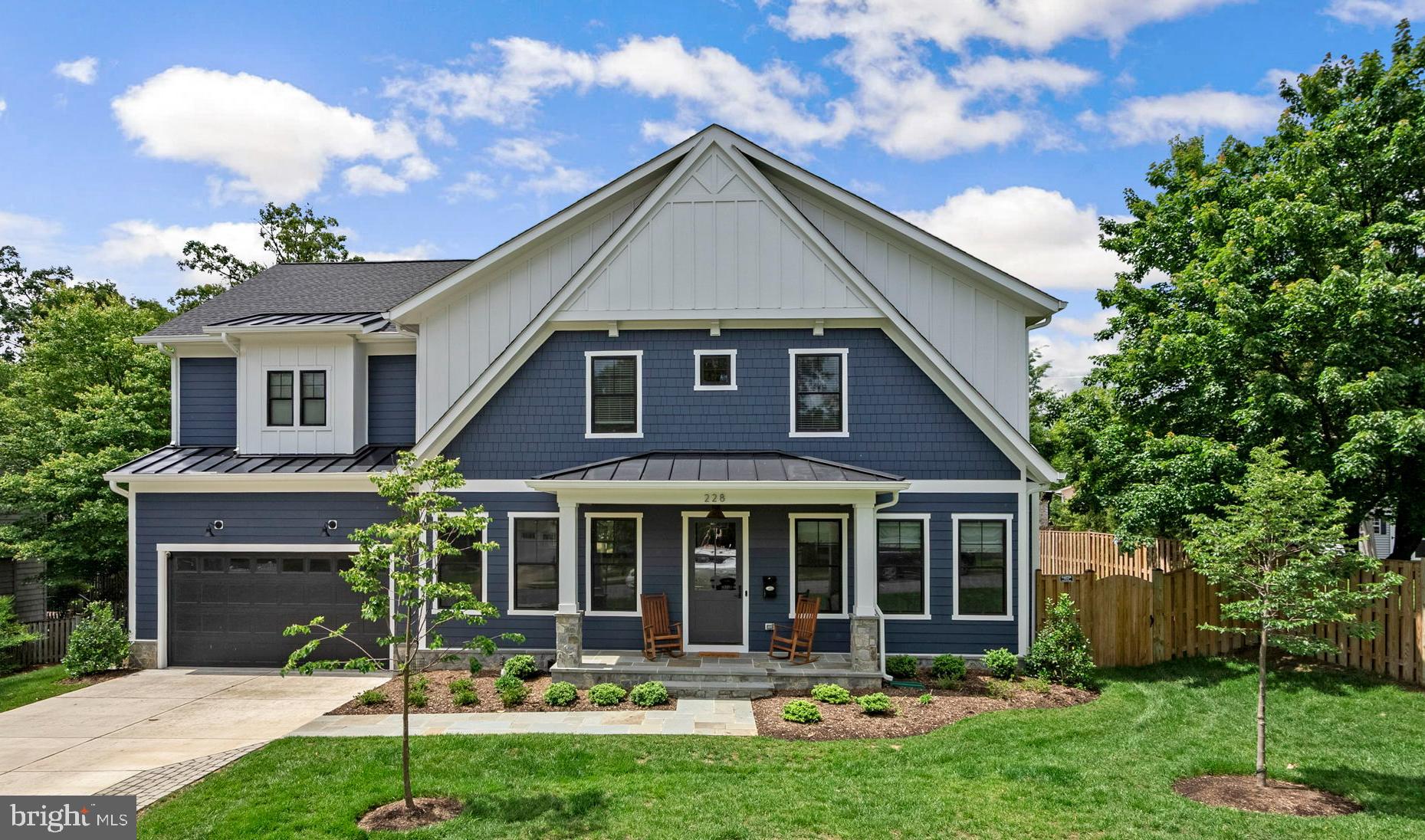 Discover convenience and luxury in this meticulously crafted 5-bedroom, 5.5-bathroom custom Craftsman home, offering over 5,000 square feet of living space in the heart of Vienna! From here, you will enjoy the convenience of intown living with great shops, eateries, Vienna Elementary, the Whole Foods Market, and the Vienna Community Center all within walking distance. Enjoy biking or a long walk on the W&OD trail with access just around the corner!  Inside, you will appreciate the attention to detail from the wide and welcoming entry foyer, the private office with glass French doors and formal dining room with elegant wainscoting. Across the back of the home is an expansive family room with a gas fireplace and coffered ceilings, a gourmet kitchen equipped with a professional 6-burner Wolf gas range, large island with waterfall quartz countertops and a breakfast nook and butler's pantry. Next is a generous walk-in pantry and convenient mudroom with built-in cubbies and direct access to the 2-car garage. The beautifully appointed owner's suite is on the second level featuring a custom dressing room with center island, and a spa-inspired en-suite bath with a large shower, separate soaking tub, water closet, and dual vanities. Three additional bedrooms, all with private baths and walk-in closets and a spacious laundry room completes this level. The fully finished lower level offers tall ceilings and a large recreation room with a wet bar for game day entertaining, another bedroom and full bathroom, a dedicated exercise room, and a versatile bonus room. And don’t miss the backyard and large deck for move-in ready for relaxing or play. Additional upgrades include solid hardwood floors throughout, 10-foot ceilings, custom built-ins, accent walls, recessed lighting, shaker doors with matte black hardware, wide casings and moldings, and an electric car charger. This 2-year young home has been made better than new by the owners with professionally installed window treatments throughout, upgraded landscaping, stone retaining and paver pathways, a custom bar with kegerator, and a professional car lift in the garage! Welcome home!