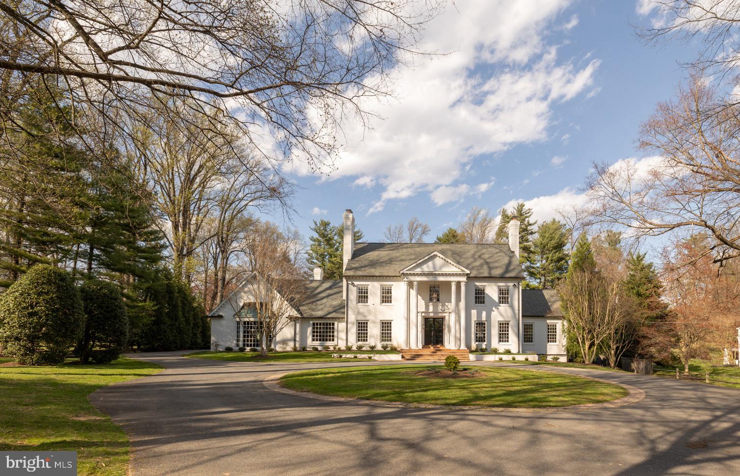 BUYER IS A LICENSED BROKER AND WAIVED THE 2.5% CO-OP IN EXCHANGE FOR A CREDIT TOWARD THE SALES PRICE, MAKING THE EFFECTIVE  PRICE $4.46M. Set back from the road on 2.01 pristine acres in the prestigious Potomac enclave of Bradley Farms, this recently renovated and reimagined luxury home is a seamless blend of traditional architecture and modern, European design. This property is the pinnacle of Potomac living, featuring a main home with six bedrooms, six bathrooms, and one half bath, tennis court, pool, pool house with wet bar, an additional full bathroom as well as a living space or seventh bedroom. In the main home, an impressive front porch with two story columns leads to a custom steel and glass double front door by the French Steel Company. A grand foyer with checkered marble floor is flanked by embassy sized formal living and dining rooms each with fireplaces, built-in cabinets, detailed moldings, and custom plaster details.Through the dining room is a meticulously designed kitchen with the finest custom finishes and cabinetry. The most noteworthy kitchen details include a 15‘ oak island, a dual-fuel Lacanche range with two ovens, Wolf wall oven, separate Sub-Zero refrigerator and freezer, two dishwashers, a breakfast nook, and two massive french doors leading to the Ipe deck. Adjacent to the kitchen is an oversized, multi-purpose mudroom that also functions as a home command center, secondary kitchen staging area, as well as a laundry room and includes access to the three car garage. On the other side of the kitchen a rear gallery with wine and beverage bar opens to a sunken family room with paneled walls, stone surround fireplace, and herringbone wood floors. The rear gallery leads to a stunning paneled library with a fireplace and soaring ceilings. A formal powder room with floating marble vanity featuring an inlay marble sink and wall mounted Waterworks fixtures rounds out the main level. On the upper level, a landing with a detailed built-in bench welcomes you to the primary suite foyer. Off the primary foyer is a spacious bedroom with a seating area, fireplace, and custom vaulted ceiling feature. Back through the primary vestibule is a hall with three closets leading to the primary bathroom. The primary bathroom features radiant heat marble floors with marble inlay rug, white oak vanities, frosted glass surround water closet, and all Waterworks plumbing fixtures including a cast iron floating tub with skylight above. Four additional bedrooms, two with a shared bathroom and two with a dedicated bathroom (one en-suite) complete the upper level. The walk-out lower level features a checkered marble foyer, wine cellar, media room, second kitchen, living space with fireplace, full bedroom suite with marble bathroom and walk-in closet, an expansive gym, additional full bathroom, and a patio. The private, flat rear yard includes an in-ground pool, pergola, tennis court with professional grade basketball hoop, and a pool house. This impressive property is located just minutes from Potomac Village, Congressional Country Club, and I-495. Whitman School Cluster!