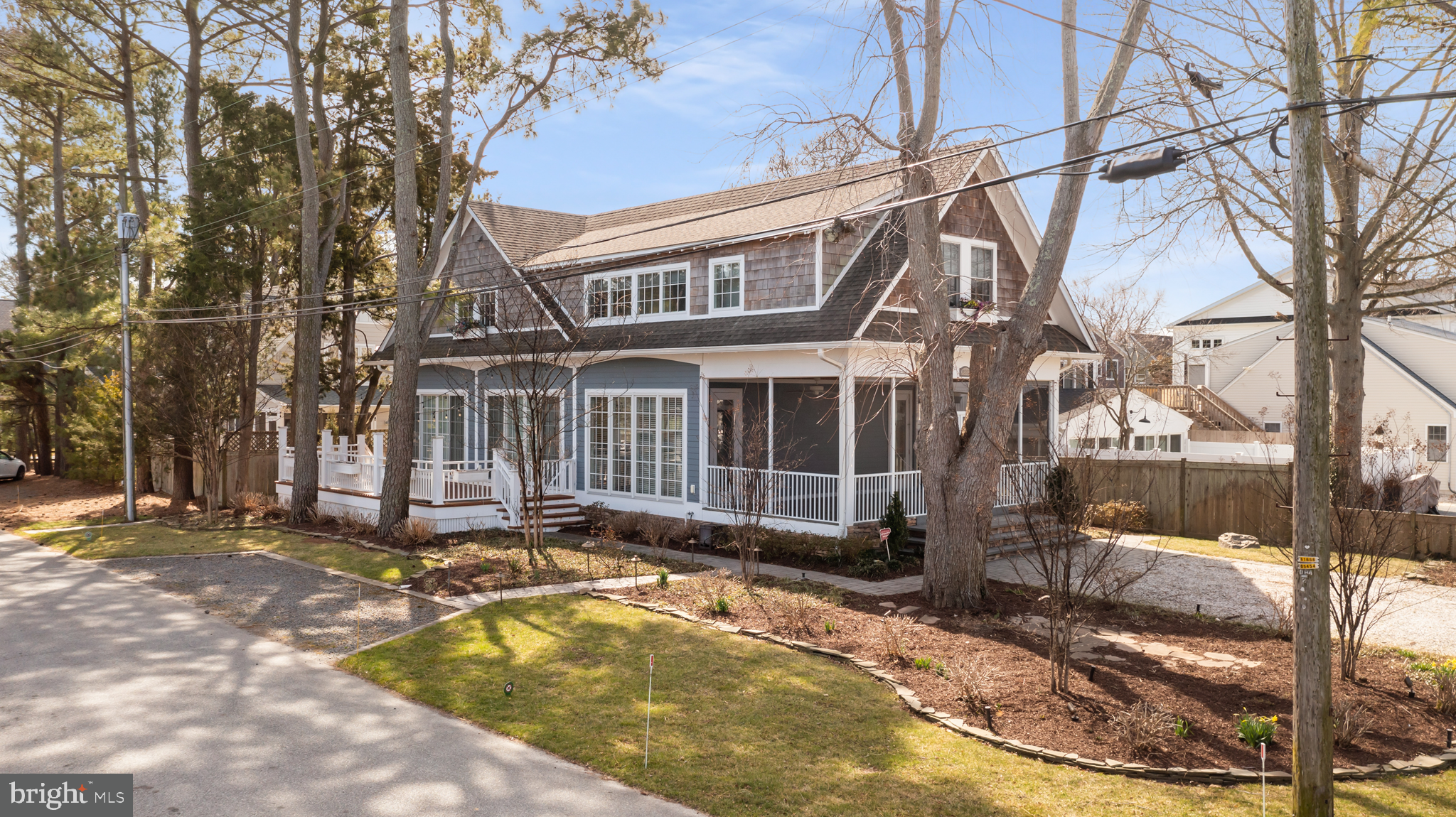 Rare to market.  East of Route One- Walk to the beach! This 9 year old coastal cottage is nestled among the pines on an exquisite tree-lined corner lot in the quiet beach neighborhood of Dodd's Addition. Convenient location east of Route 1 in the "Forgotten Mile" allows you to walk to either Dewey or Rehoboth Beach & enjoy the nearby amenities, restaurants and beaches. This meticulously maintained home boasts nearly 3700 sf of living space on 3 floors and balances all of the modern features of a new home with the small-town beach cottage feel of coastal Delaware. Home features include 2 primary bedrooms with en suite baths and vaulted ceilings, gourmet kitchen, bamboo floors, fully finished basement with new LVP flooring and wet bar, plenty of windows for natural light and an open floor plan perfect for entertaining. A newly added, spacious, open air deck catches the summer breeze and the well landscaped yard with extensive hardscaping lends beautiful curb appeal.  This home is located just outside of town limits so there are no additional HOA fees or taxes and is perfectly placed on a tree-lined corner lot. Easy access to the beach and water makes this location highly desirable.