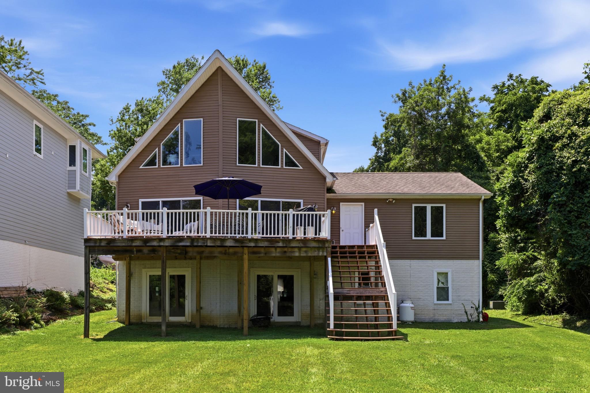 Welcome to a waterfront retreat where timeless coastal living meets modern luxury. Perfectly positioned on approximately one private acre along the tranquil waters of Mill Creek with direct access to the Chesapeake Bay, this custom-built home offers the exceptional lifestyle that Annapolis is known for.

Designed to capture breathtaking water views from nearly every room, this beautifully appointed 3 bedroom, 2.5 bath Chalet features an open, light-filled floor plan with soaring ceilings, rich hardwood flooring, a cozy fireplace, and expansive windows that bring the outdoors in. The gourmet kitchen flows seamlessly into the living and dining spaces, creating an inviting atmosphere for entertaining or relaxing while enjoying picturesque waterfront vistas. The fully equipped kitchen boasts modern stainless steel appliances and ample space for entertaining.  Wake up each morning in the serene primary suite overlooking the water, which features a large walk-in closet and a whirlpool soaking tub. Then, step outside to experience your own private waterfront oasis. The expansive deck is ideal for hosting family and friends, enjoying morning coffee, or taking in spectacular sunsets over Mill Creek. 

This property includes docking for two boats and deep-water access, perfect for boating, crabbing, and fishing.  Conveniently located just five minutes from the U.S. Naval Academy, West Annapolis, and historic downtown Annapolis, this home provides easy access to shopping, dining, and entertainment.  Washington, D.C and Baltimore are each only 30 minutes away. Local highlights include Cantler's Riverside Restaurant, a renowned spot for seafood and steamed crabs right on the water, as well as the charming shops and cafes along Main Street and in nearby West Annapolis.  Outdoor lovers will appreciate the close proximity to Sandy Point State Park, as well as nearby golf courses and trails for year-round recreation. 

Whether you’re searching for a primary residence or legacy waterfront property to enjoy for generations, this extraordinary home offers a rare opportunity to own one of Annapolis’ most desirable waterfront settings.

Schedule your private tour today and discover the Chesapeake lifestyle you’ve been dreaming of.