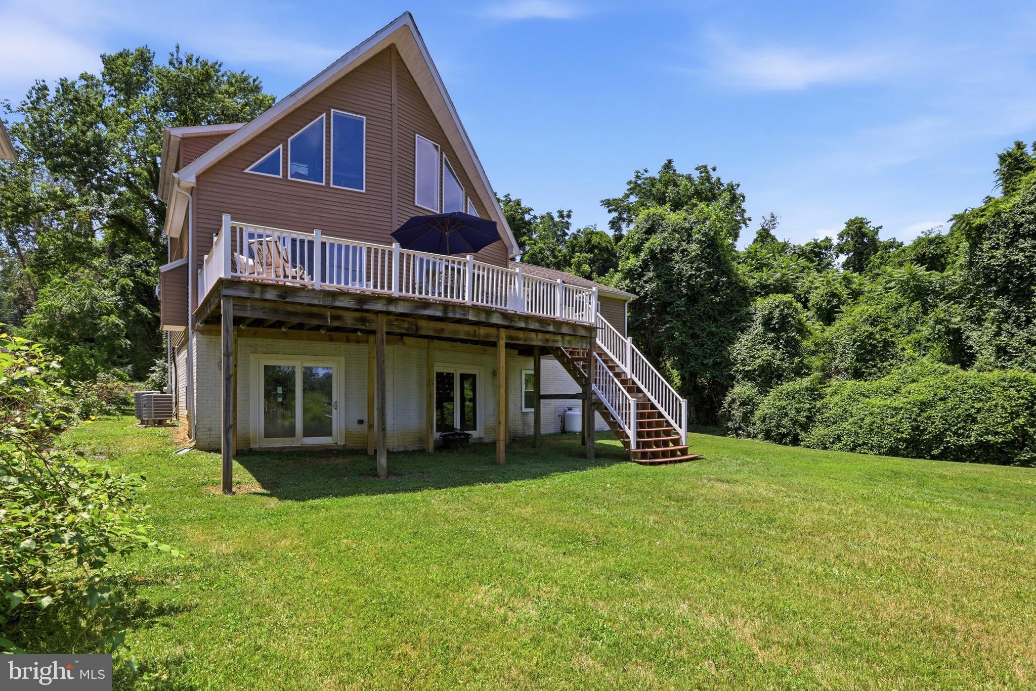 Welcome to a waterfront retreat where timeless coastal living meets modern luxury. Perfectly positioned on approximately one private acre along the tranquil waters of Mill Creek with direct access to the Chesapeake Bay, this custom-built home offers the exceptional lifestyle that Annapolis is known for.

Designed to capture breathtaking water views from nearly every room, this beautifully appointed 3 bedroom, 2.5 bath Chalet features an open, light-filled floor plan with soaring ceilings, rich hardwood flooring, a cozy fireplace, and expansive windows that bring the outdoors in. The gourmet kitchen flows seamlessly into the living and dining spaces, creating an inviting atmosphere for entertaining or relaxing while enjoying picturesque waterfront vistas. The fully equipped kitchen boasts modern stainless steel appliances and ample space for entertaining.  Wake up each morning in the serene primary suite overlooking the water, which features a large walk-in closet and a whirlpool soaking tub. Then, step outside to experience your own private waterfront oasis. The expansive deck is ideal for hosting family and friends, enjoying morning coffee, or taking in spectacular sunsets over Mill Creek. 

This property includes docking for two boats and deep-water access, perfect for boating, crabbing, and fishing.  Conveniently located just five minutes from the U.S. Naval Academy, West Annapolis, and historic downtown Annapolis, this home provides easy access to shopping, dining, and entertainment.  Washington, D.C and Baltimore are each only 30 minutes away. Local highlights include Cantler's Riverside Restaurant, a renowned spot for seafood and steamed crabs right on the water, as well as the charming shops and cafes along Main Street and in nearby West Annapolis.  Outdoor lovers will appreciate the close proximity to Sandy Point State Park, as well as nearby golf courses and trails for year-round recreation. 

Whether you’re searching for a primary residence or legacy waterfront property to enjoy for generations, this extraordinary home offers a rare opportunity to own one of Annapolis’ most desirable waterfront settings.

Schedule your private tour today and discover the Chesapeake lifestyle you’ve been dreaming of.
