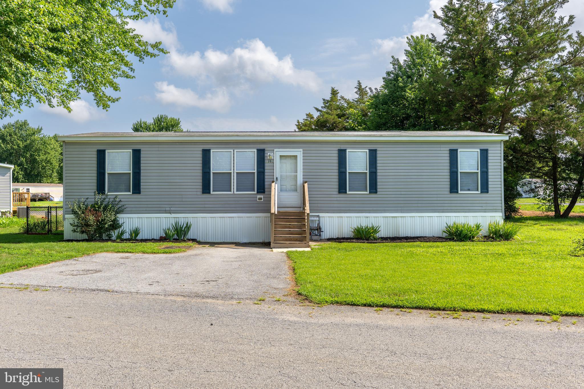 Welcome to this beautifully maintained 2020 Redman double-wide, offering the space you’ve been searching for with 4 generously sized bedrooms—a rare find in this community!
Freshly updated with brand-new carpeting and fresh paint throughout, this move-in ready home offers a bright, modern feel from the moment you step inside. The spacious kitchen is equipped with a gas range and a premium stainless steel refrigerator featuring the sought-after third drawer, an upgraded appliance valued at approximately $3,000. 8x10 Shed for additional storage needs .
Situated on a desirable corner lot, you’ll enjoy peaceful wooded views across the street, providing a sense of privacy and natural beauty. Outside, the fully fenced chain-link backyard is perfect for pets, play, or relaxing outdoors, while two dedicated parking spaces offer added convenience.
If you’ve been waiting for a true 4-bedroom home in this community, this is your opportunity. Combining modern construction, fresh updates, a functional layout, and an unbeatable setting, this home is ready for its next owner. Schedule your private tour today!