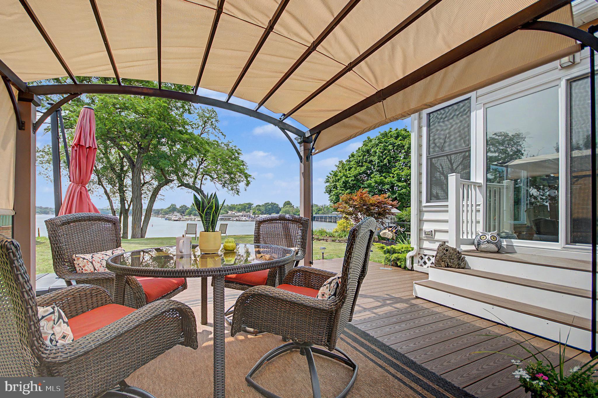 Welcome to Sunset Beach, where every day feels like a vacation! This beautifully updated waterfront home is move-in ready and offers spectacular panoramic views overlooking Stoney Creek at its intersection with Nabbs Creek. Relax year-round in the heated and cooled sunroom while enjoying breathtaking water views and some of the community's famous sunsets. This is not a drive-by, the interior and views must be seen to be fully appreciated.

Boaters will love this incredible location with easy access to Annapolis, the Magothy River, Rock Hall, and Baltimore's Inner Harbor. The community also features a beach and boat ramp on Granada Road, along with a nearby park and playground.

Inside, you'll find numerous upgrades including a whole-house UV-C air sanitizer, towel warmer in the primary bath, stamped concrete driveway, and hardwood flooring beneath the luxury vinyl plank flooring. The main level offers approximately 1,590 finished square feet, including the four-season sunroom with its own HVAC system. The finished lower level adds approximately 1,441 square feet and includes a spacious recreation / family room, full bath, workshop, abundant storage, and flexible living space perfect for entertaining or hobbies.

Additional storage is available beneath the sunroom for kayaks and other water toys, as well as in the storage shed.

There are no mandatory HOA fees; membership in the Sunset Beach Improvement Association is voluntary and provides access to community amenities including the beach, boat ramp, slips, and community area.

Low-maintenance living, extensive updates, incredible boating access, and unforgettable waterfront views make this a rare opportunity to own a piece of the Chesapeake lifestyle.