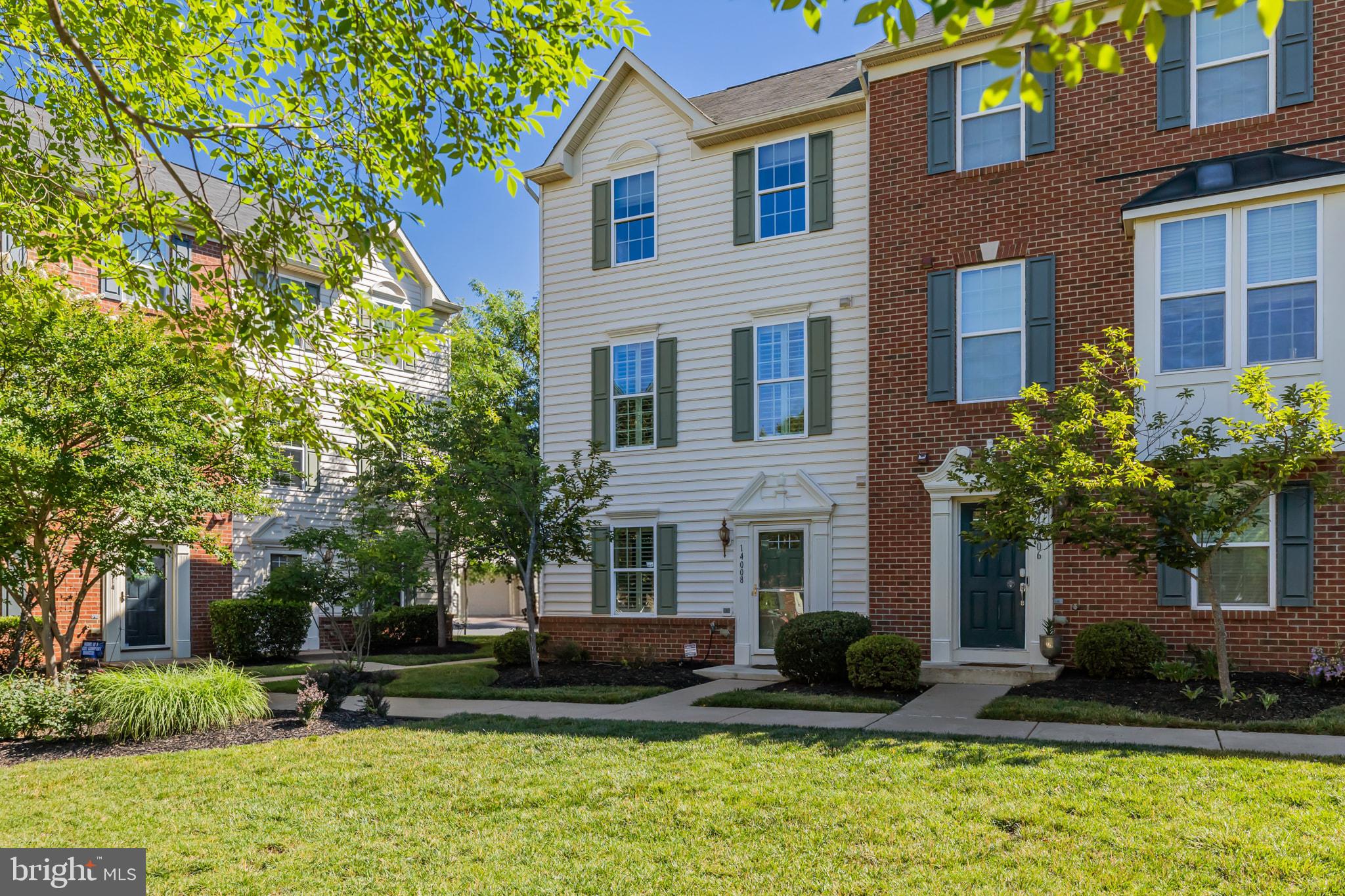 Perfectly positioned on a desirable end-unit facing open green space, this beautifully maintained townhome offers the ideal blend of comfort, style, and location!  A welcoming entry level boasts hardwood floors that continue throughout two levels of the home and provides direct access to the rear-load two-car garage.
The open-concept main level includes a spacious living room that flows seamlessly into the pristine kitchen, featuring a large center island, granite countertops, stainless steel appliances, and a large pantry. The adjacent dining area provides the perfect space for gatherings and offers direct access to the deck for outdoor enjoyment. Elegant plantation shutters throughout add timeless sophistication and charm. Thoughtfully designed for convenience, the home includes two half baths—one on the entry level and another on the main living level.

Upstairs, the bright and neutral bedrooms create a peaceful retreat. The exceptional primary suite is highlighted by an elegant tray ceiling, spacious walk-in closet, and a private ensuite bath featuring dual vanities and a large walk-in shower. An upper-level laundry area adds everyday convenience and functionality.  .Enjoy fantastic neighborhood amenities including a clubhouse, community pool, and tot lots. Conveniently located steps from shopping, dining, and easy access to commuter routes. **HVAC 1.5 Yrs old**