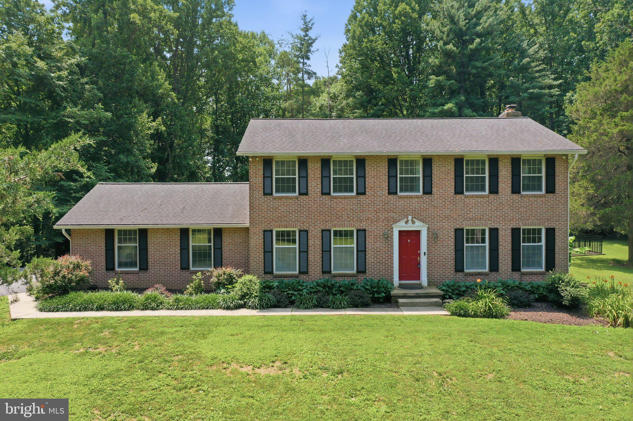 Welcome to this stunning, all brick, custom Colonial nestled on 2.07 private acres in desirable Brookeville. Built in 1983 and thoughtfully enhanced over the years, this 4-bedroom, 2.5-bath home blends timeless character with modern comfort, offering a peaceful retreat surrounded by mature trees and outdoor amenities.

Step inside to a warm and inviting open-concept layout featuring hardwood and tile flooring throughout the main level. The heart of the home showcases a beautifully updated kitchen with granite countertops, a center island, stainless steel appliances, and stylish finishes. The dining and living spaces flow effortlessly together, highlighted by a cozy pellet stove with a stone hearth and custom built-ins, making this the perfect gathering space for everyday living or entertaining. A bright sunroom with a mini-split provides additional year-round enjoyment and overlooks the backyard oasis.

The upper level features all bedrooms, including an owner’s suite with walk-in closet, spacious bathroom and jetted tub. The finished walk-up basement expands your living space with updated finishes and endless possibilities for recreation, entertaining, home office, or guest space.

The outdoor setting is truly special, enjoy over two acres of privacy with mature landscaping, a spacious deck (2025), firepit area, storage shed, and an inviting in-ground pool with concrete surround and aluminum fencing. An invisible dog fence adds convenience, while the oversized 2-car garage provides exceptional parking and storage.

Peace of mind comes with an impressive list of updates, including the roof and gutters (2011), HVAC (2024), updated bathrooms, water heater (2025), pool liner and high-efficiency pump (2021), fencing (2022), pellet stove (2025), septic pump (2025), expansion tank (2025) and more. Additional updates include extensive painting (2026), recently serviced systems (2026), a generator, and an active radon mitigation system already in place.

A rare opportunity to enjoy privacy, space, thoughtful updates, and a beautifully maintained home, all with no HOA.