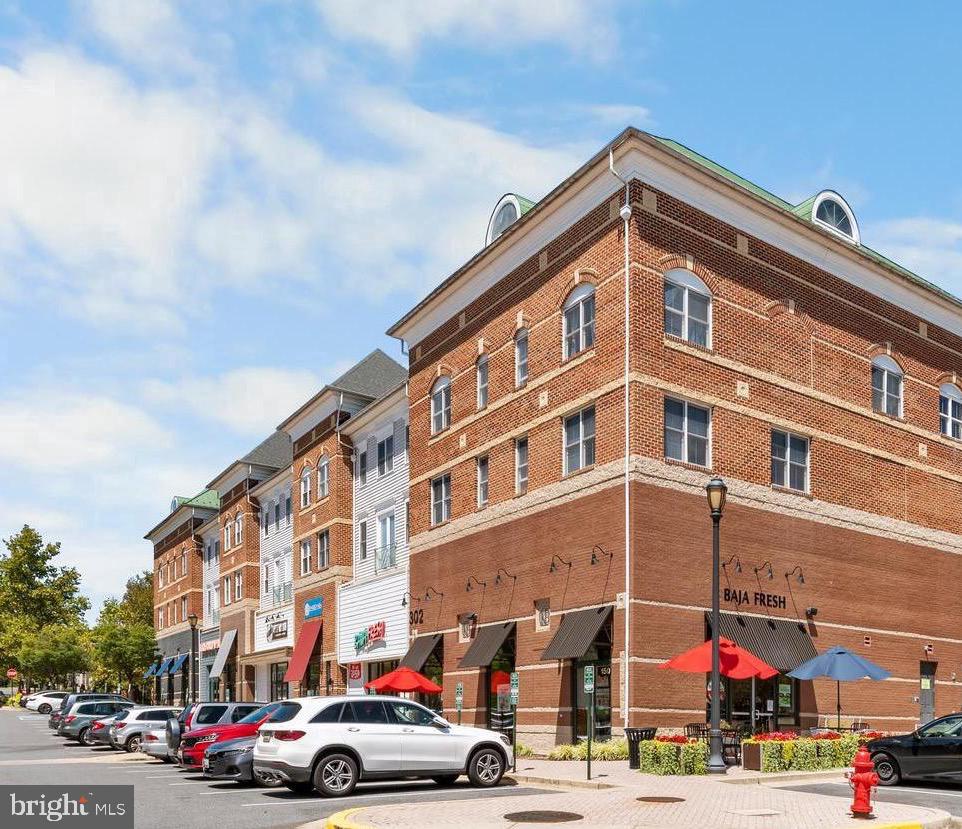 New Price! 2BR/2BA condo in the heart of King Farm’s Village Center! Ideally located above the shops and restaurants, this bright and stylish home offers the perfect blend of convenience, comfort, and charm.

Access the building through a private residents-only elevator and go to 2nd floor,  following a welcoming, sunlit hallway to the unit. Inside, the well-appointed kitchen features rich wood cabinetry, Santa Cecilia granite countertops, and abundant cabinet space—ideal for everyday living and entertaining. The open-concept living and dining area is filled with natural light and enhanced by upgraded shutters, creating a warm and inviting atmosphere.

Enjoy the convenience of living just steps from shopping, dining, parks, and community amenities, with easy access to major commuter routes and the Metro.

Recent updates include:
The condo building roof  was newly replaced in 2024. This condo has a lot of upgrades:
• New HVAC system (May 2025),  Stainless steel refrigerator (Sept 2025), stainless steel over-the-range microwave (Aug 2025),  New shower door in second bathroom (Oct 2025),  New carpet (Nov 2025)

All offers are welcome!