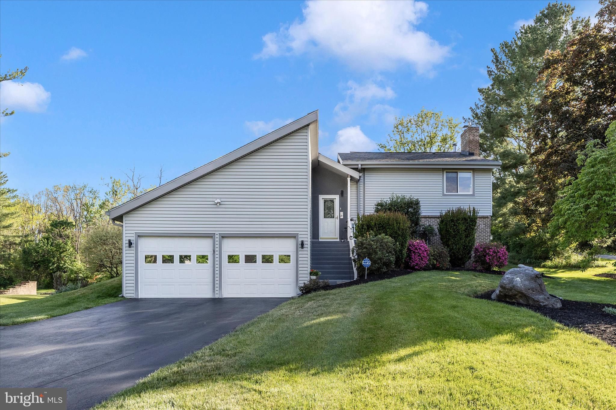 Must see, well maintained, 1970s contemporary in the desirable Robinwood subdivision — 4 bedrooms, 3 baths. Sited on a prominent corner lot, this home features a bright sunroom, a cozy living area, large primary bedroom with ensuite bath, a finished basement with a family room with a gas fireplace—ideal for media or play. Outdoor amenities include a hot tub, gazebo, and generous yard perfect for entertaining and gardening. You will have ample storage with the Two-car garage, workshop. Oh and did we mention, no HOA. Great blend of vintage character and functional living space — schedule your showing today.