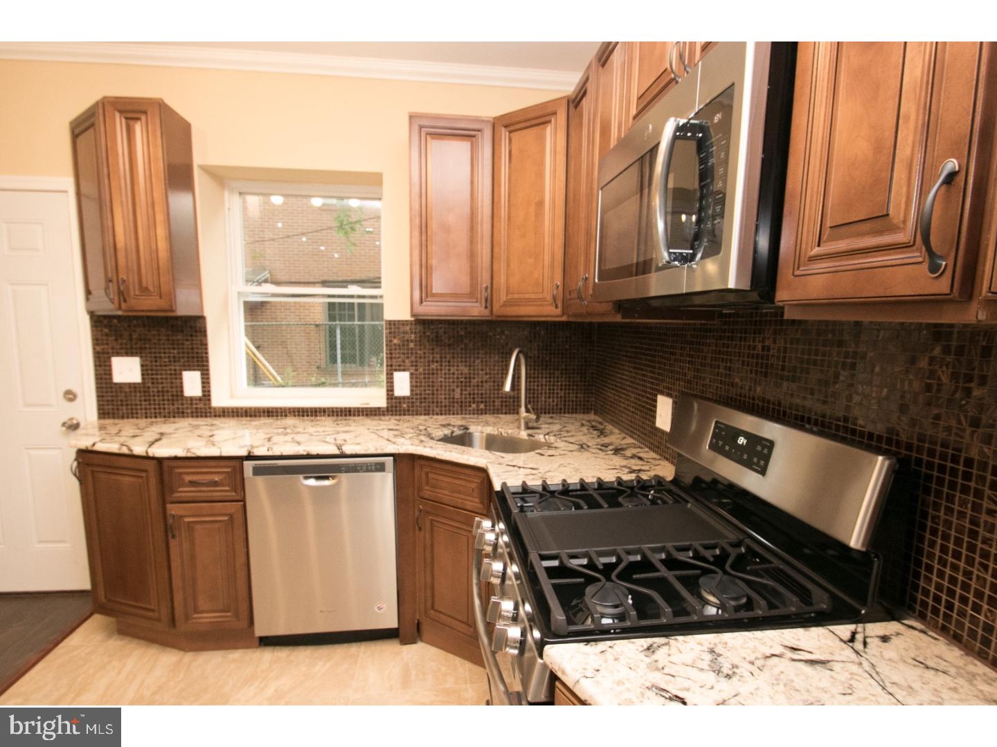 Unlike any other home on the market, this Cobbs Creek property is truly a something to see! Located on a beautiful quiet block with every extra you can imagine! The home has undergone a complete renovation inside and out! All new windows have been added and all new mechanicals have been installed to include (HVAC, Electric, Plumbing). The first floor features an open floor plan with a large living and dining area. There is also a powder room on the first floor for convenience. A new kitchen has been added to include all new appliances and tile throughout! In the kitchen you will find gorgeous wood cabinets. There is a also a newly constructed large deck, excellent for entertaining! Upstairs there are 3 bedrooms and a spa bath! There is also an additional half bath, central air and many more upgrades throughout!