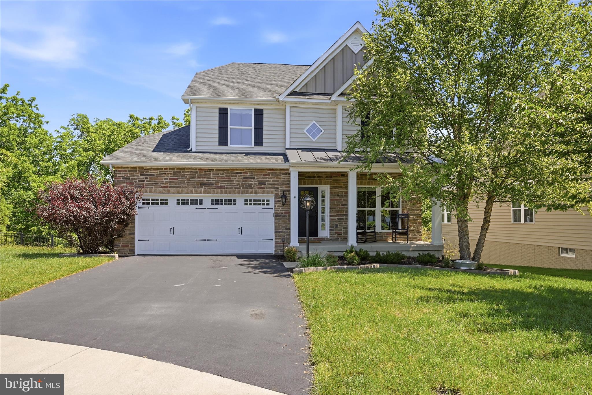 With the market for homes in Lake Frederick being highly competitive, this listing presents a superior opportunity. Imagine utilizing a design-driven approach to define sophisticated "flex spaces", transforming a spacious floor plan into distinct functional zones, from a productive home office to a tranquil evening retreat. Upstairs, the loft offers flexible living space ideal for a home office, movie nights, or guests. The heart of this home is the seamless flow from the chef's kitchen to the family room, creating a unified space perfect for entertaining and everyday life.  Imagine effortless hosting and relaxed family moments in this bright, expansive area. The inviting living area features a gas fireplace with remote for perfect for cozy evenings at home.  A deck built in 2020 from durable Trex Decking creates the perfect platform for an outdoor "Great Room". From this elevated retreat, you can enjoy a beautifully landscaped setting with a tranquil glimpse of the resort-style lakeside views that define Lake Frederick. A lower concrete patio adds functional under-deck storage, while a front lawn irrigation system ensures exterior maintenance. The unfinished basement with a bathroom rough-in offers excellent potential for future expansion. The finished garage is wired for an electric vehicle charger.