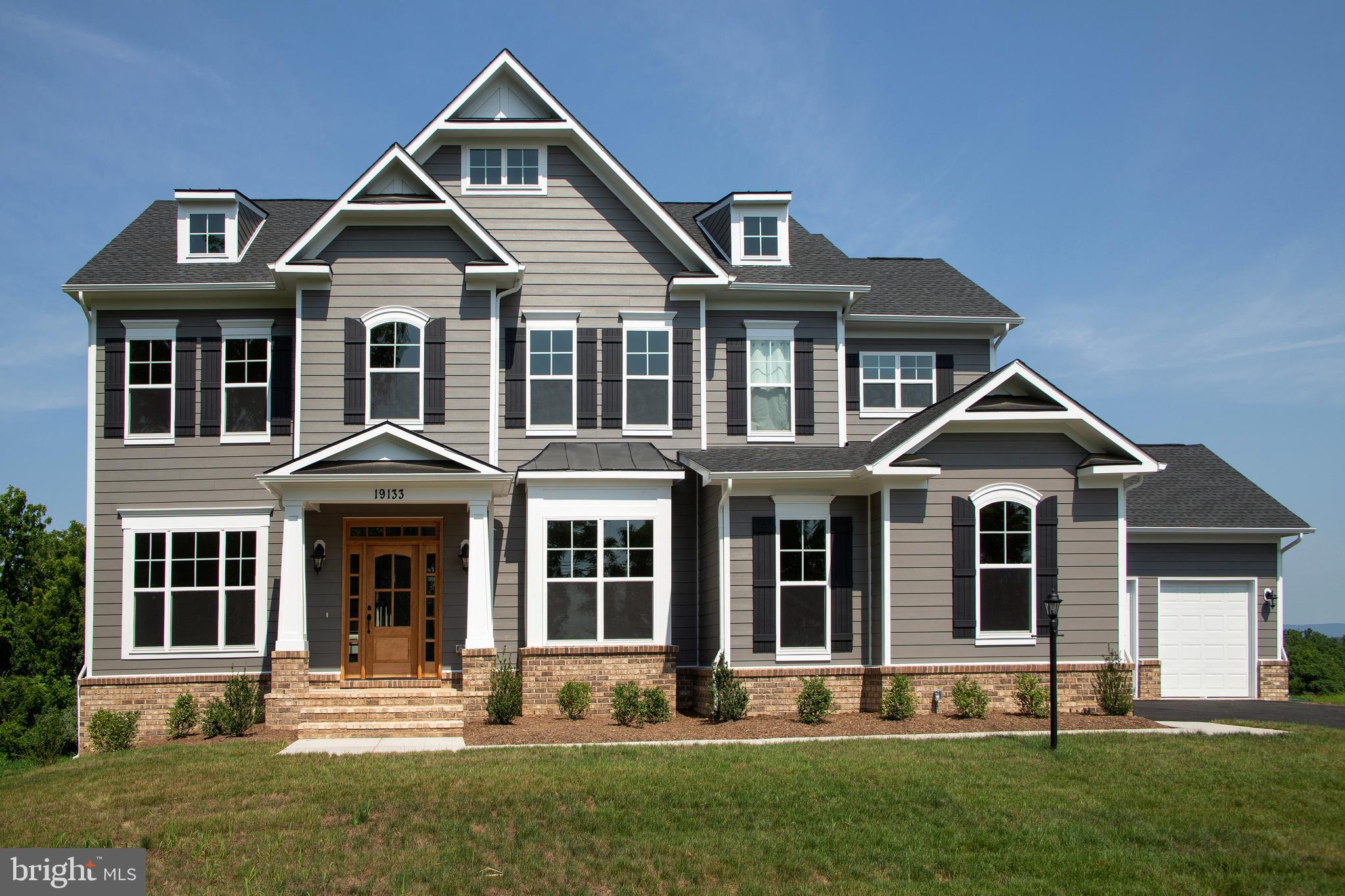 FINISHED BASEMENT & LARGE DECK OFF FAMILY ROOM.  THIS HOUSE IS MOVE IN READY!  3.23 Acres. Quality new home construction, without the wait, in the established community of Old Wheatland with the popular Waterford address. This Huntwick Place has the Carrington spectacular farmhouse kitchen with 4' extension and beamed ceiling.  Other features include a three car garage, quartz kitchen and bath countertops, rear side club room, deck, oak main staircase, deluxe second floor with deluxe laundry room and a walk out basement.

Visit our DECORATED MODEL HOMES AND SALES OFFICE-16670 Huntwick Place, Hamilton , VA 
 20158. Directions from Leesburg: Route 7 west to Hamilton Station Rd exit. Turn right on Hamilton Station Rd. Right on Colonial Hwy. Right on Ivandale St. and proceed under Rte 7. Ivandale Farm is on the right near the intersection of Ivandale Rd. and Piggott Bottom Rd. Open Daily 10-5.

HOA fees are estimated
Features, square footage, beds & baths are per base floor plans.