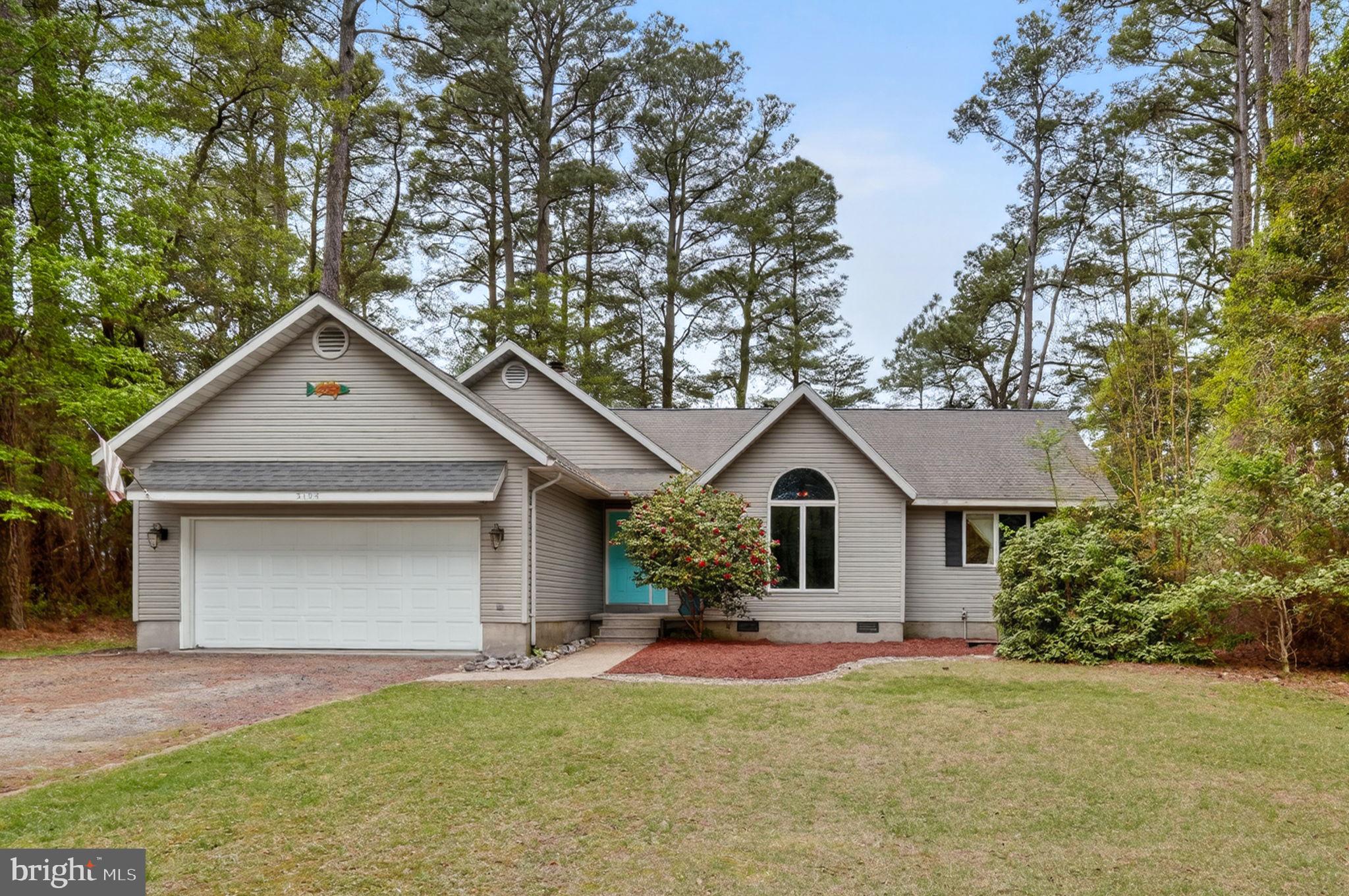 Tucked among the pines and perfectly positioned along the golf course in the sought-after Captain’s Cove Golf & Yacht Club, this inviting contemporary ranch-style home offers the perfect blend of comfort, privacy, and coastal lifestyle. Featuring 3 bedrooms, 2 baths, and an attached 2-car garage, the home welcomes you with soaring rooflines, mature landscaping, and eye-catching architectural details. Situated on approximately 0.24 acres, the property enjoys beautiful golf course frontage with a peaceful setting surrounded by nature.

Step inside to a bright and airy great room where soaring vaulted ceilings with exposed wood beams and a stunning stone fireplace create an impressive focal point. Oversized windows and glass doors fill the home with natural light while drawing your attention to the beautiful outdoor surroundings and golf course views beyond. The open layout flows effortlessly into the spacious dining area and kitchen, making entertaining easy and comfortable. The kitchen features abundant cabinetry, a center island, breakfast bar seating, and plenty of room for gathering with family and friends.

Down the hall, you’ll find all three bedrooms conveniently located on one level, including a spacious primary suite with a walk-in closet and private bath. The guest bedrooms offer generous space and charming architectural details, including beautiful arched windows that add character and natural light. A bright enclosed porch/sunroom with skylights provides the perfect flex space for relaxing, hobbies, fitness equipment, or enjoying the included hot tub year-round.

Outdoor living is just as appealing, with a large rear deck overlooking the golf course and mature trees, creating a peaceful retreat for morning coffee, grilling, or evenings under the stars. The backyard offers an open yet private feel, with direct access to the scenic golf course setting.

As part of Captain’s Cove Golf & Yacht Club, residents enjoy incredible amenities including indoor and outdoor pools, fitness center, golf course, marina, boat ramp, waterfront restaurant, playgrounds, pickleball and basketball courts, walking trails, and more. Conveniently located near Chincoteague Island, Assateague Beach, Wallops Flight Facility, and the Eastern Shore’s beautiful waterways, this home is ideal as a full-time residence, vacation getaway, or investment opportunity.