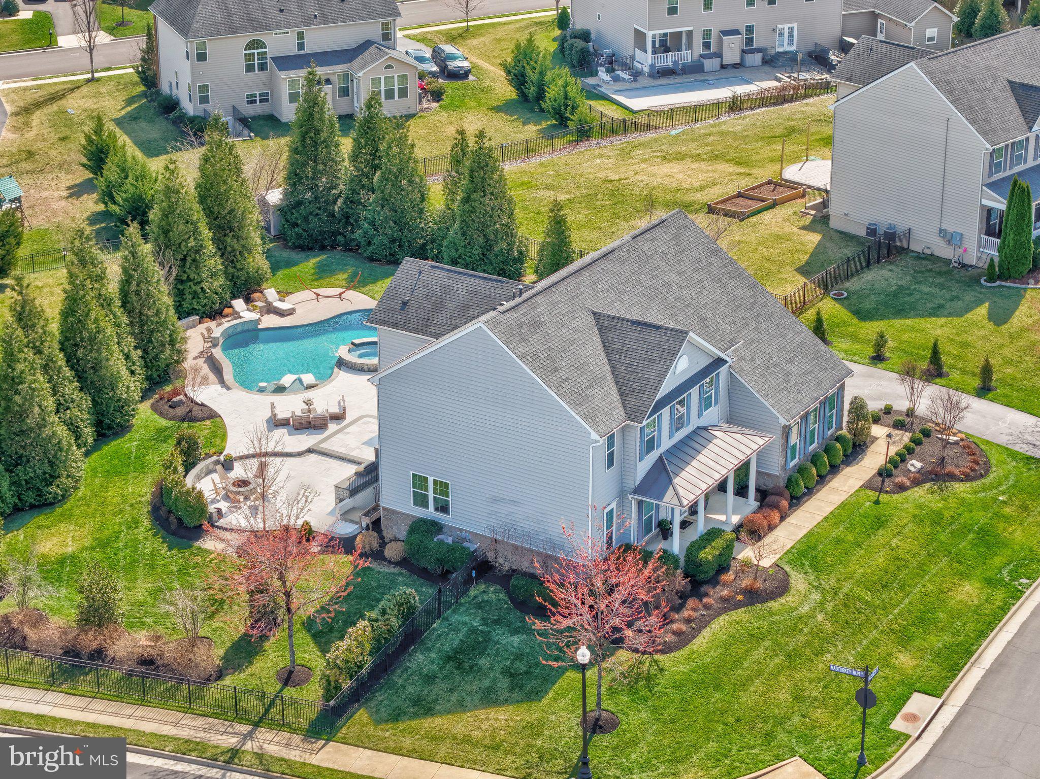 Beautifully updated home in the highly sought-after Dawson’s Corner community offering over 5,200 sq ft and $500K+ in upgrades. Resort-style backyard features a heated saltwater pool with fountains and LED lighting, 8-person hot tub, expansive multi-level patios, outdoor kitchen, fire pit, built-in speakers, patio TV, and a covered composite deck—perfect for entertaining.

The main level showcases a remodeled gourmet kitchen with oversized island, quartz countertops and backsplash, upgraded cabinetry, newer appliances (2025), and a bright breakfast area. Spacious family room with updated fireplace, plus formal living and dining rooms, private office, and upgraded mudroom. Hardwood flooring throughout the main level.

Upstairs offers a luxurious owner’s suite with sitting area, dual walk-in closets, and spa-like bath, along with three additional bedrooms, updated bathrooms, and a renovated laundry room with new washer/dryer (2025).

The finished walk-up basement includes a large rec room, theater room with projector and screen, built-ins, fireplace, full bath, and extra refrigerator.

Additional features include smart home upgrades (thermostats, lighting, security system), outdoor lighting, shed, fenced yard, and mature landscaping. Conveniently located near shopping, dining, major commuter routes, and Dulles Airport.
The deadline for submitting offers is Monday, March 23, at 6:00 PM.