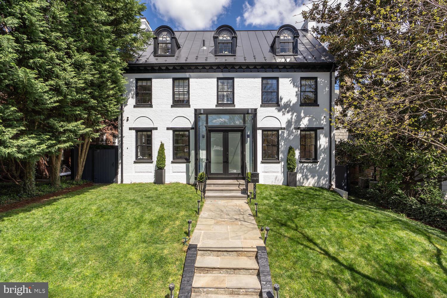 New on Market! This spectacular 6 bedroom, 6.5 bathroom 1920’s Colonial went through a major renovation in 2021 by acclaimed Architect, Mark McInturff and builder Added Dimensions. 5,573 sqft across four levels, the residence is sited opposite a charming park off Massachusetts Avenue NW and boasts dramatic, flowing living spaces (indoors and out) leading to an expansive screened porch with terraces, decks, a landscaped backyard, a pool, with gorgeous views from every room.  To complete this tranquil picture, a guest house/office adjoins the pool, and is creatively positioned above a (hidden) 2-car garage. Historic traces of the original home were preserved and imaginatively juxtaposed against modern elements, offering the perfect blend of traditional and new. Perfectly situated between Georgetown, Woodley Park,  Massachusetts Heights and Cathedral Heights with all the shopping, restaurants and other services they provide. Don’t miss this unique find in Observatory Circle.