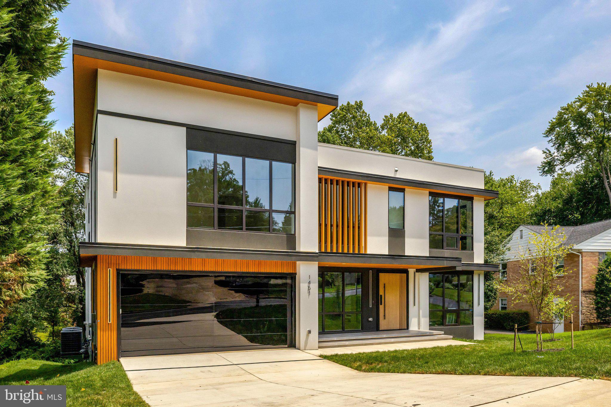 This stunning custom-built residence offers over 8,000 square feet of meticulously designed living space, seamlessly blending luxury, functionality, and modern elegance—just minutes from Washington, D.C.
The thoughtfully crafted layout includes a main-level guest suite, four spacious en-suite bedrooms on the upper level, and a private lower-level suite—ideal for multi-generational living or hosting long-term guests.
Step into a chef’s dream kitchen featuring sleek Italian custom cabinetry, a striking oversized porcelain island, premium Thermador appliances, and a fully equipped spice kitchen with GE Profile appliances. Complementing the space are a butler’s pantry, breakfast nook, formal and informal powder rooms, dog wash station, and a well-appointed mudroom. A floating metal staircase with glass rails adds architectural drama, while the attached 2-car garage connects seamlessly to the interior.
The luxurious primary suite is a sanctuary, complete with a cozy fireplace, private balcony, wine bar, dual walk-in closets, and a spa-inspired bathroom with soaking tub and bespoke vanities. An additional family loft and a large laundry room add comfort and convenience.
The fully finished basement is an entertainer’s paradise featuring a spacious rec room with fireplace, a designer wet bar with Calacatta marble quartz countertops, a glass-enclosed fitness room, Zen spa with a dry sauna, and an additional guest suite.
Additional features include dual-zone high-efficiency HVAC systems, smart thermostats, and designer finishes throughout.
Don’t Miss This Rare Opportunity
Be among the first to experience this exceptional new construction home in the heart of McLean. Message us today for early access.
