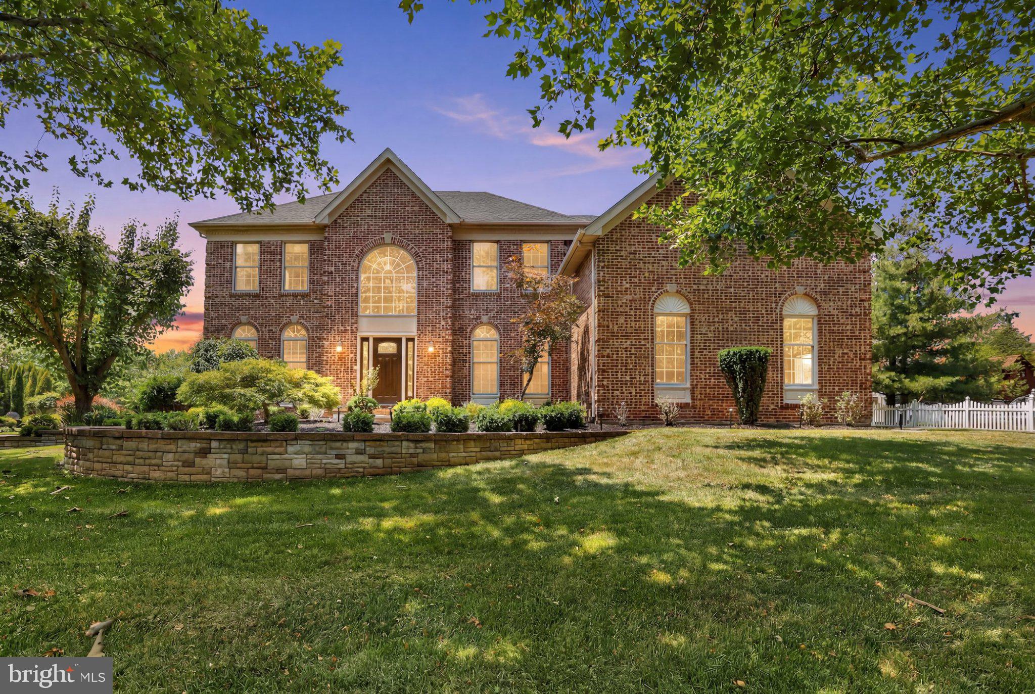 *By Appointment Only* Welcome to 619 Chatwyck Lane, a showstopper in Afton Chase that offers the perfect combination of luxury and practicality. Set on a spacious lot within walking distance to Township parks, pools, ball fields, the library, and Edgewood Elementary School, this brick-exterior home has been extensively and thoughtfully upgraded over the past few years. Featuring a stunningly renovated kitchen, a newer roof and HVAC system, primary closet installations, recessed lighting, full fireplace replacement and added surround, remodeled bathrooms, fresh paint, replaced carpeting, laundry room remodel, modern flooring throughout and so much more, this home represents a rare, truly turnkey opportunity in Yardley. Inside, the home strikes a flawless balance of being both grand and inviting. Gleaming hardwood floors flow seamlessly through the main level as abundant natural light fills every room, creating a bright, airy ambiance. The main floor offers generous living and dining rooms, a modern, remodeled kitchen with a sunny breakfast area, and a warm family room with vaulted ceilings, skylights, and anchored by a beautifully replaced electric fireplace with incredible surround. A first‑floor office adds excellent flexibility, while the rear Trex deck and expansive backyard invite a true indoor‑outdoor lifestyle. This level is completed by a convenient laundry room, a powder room, and access to the three-car garage. Upstairs, four bedrooms and two full bathrooms await. The primary suite is a private retreat featuring plush carpeting, two walk-in closets recently installed, and a stunningly renovated ensuite bath complete with a walk-in shower, freestanding soaking tub, and an elegant double-sink vanity with abundant storage. A true standout feature is the versatile bonus study situated right within the primary suite, perfect for a private home office, nursery, or workout space. The three additional bedrooms are generously sized with ample closet space and share a thoughtfully updated full hallway bath. The lower level boasts a fully finished basement with added powder room that offers incredible additional living space, perfect for movie nights, gaming, or a home gym. Yardley remains one of the most sought‑after communities in Bucks County, celebrated for its small‑town charm, scenic riverfront views, and the highly regarded Pennsbury School District. Enjoy local restaurants, coffee shops, boutiques, and easy access to parks, trails, and the Delaware Canal Towpath. Commuters will appreciate the convenience of Yardley Station’s direct service to Center City Philadelphia, as well as quick access to I‑295 and Route 1 for seamless travel to Princeton, Philadelphia, and surrounding business hubs. Combining a quiet residential setting with exceptional convenience, this property is truly special.