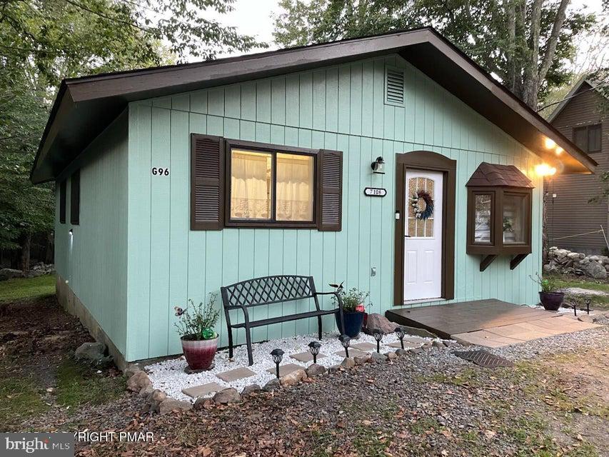 Welcome to this cozy and well maintained 3 bedroom 1 bathroom ranch nestled in the heart of the Poconos. Perfect as a full-time residence, vacation getaway or as an investment property, this home presents space for bonding or just recuperating. The ranch-style design offers comfort, privacy, and easy access to the year-round amenities of A Pocono Country Place -- a secure, gated community surrounded by lakes, forests, mountain scenery, water parks and shopping. Step inside to find a bright, open living area with large windows, and a wood-burning fireplace ideal for family gatherings. The home features three cozy bedrooms, a full bath. The only thing missing is your personal touch. Come and see if this home is for you.